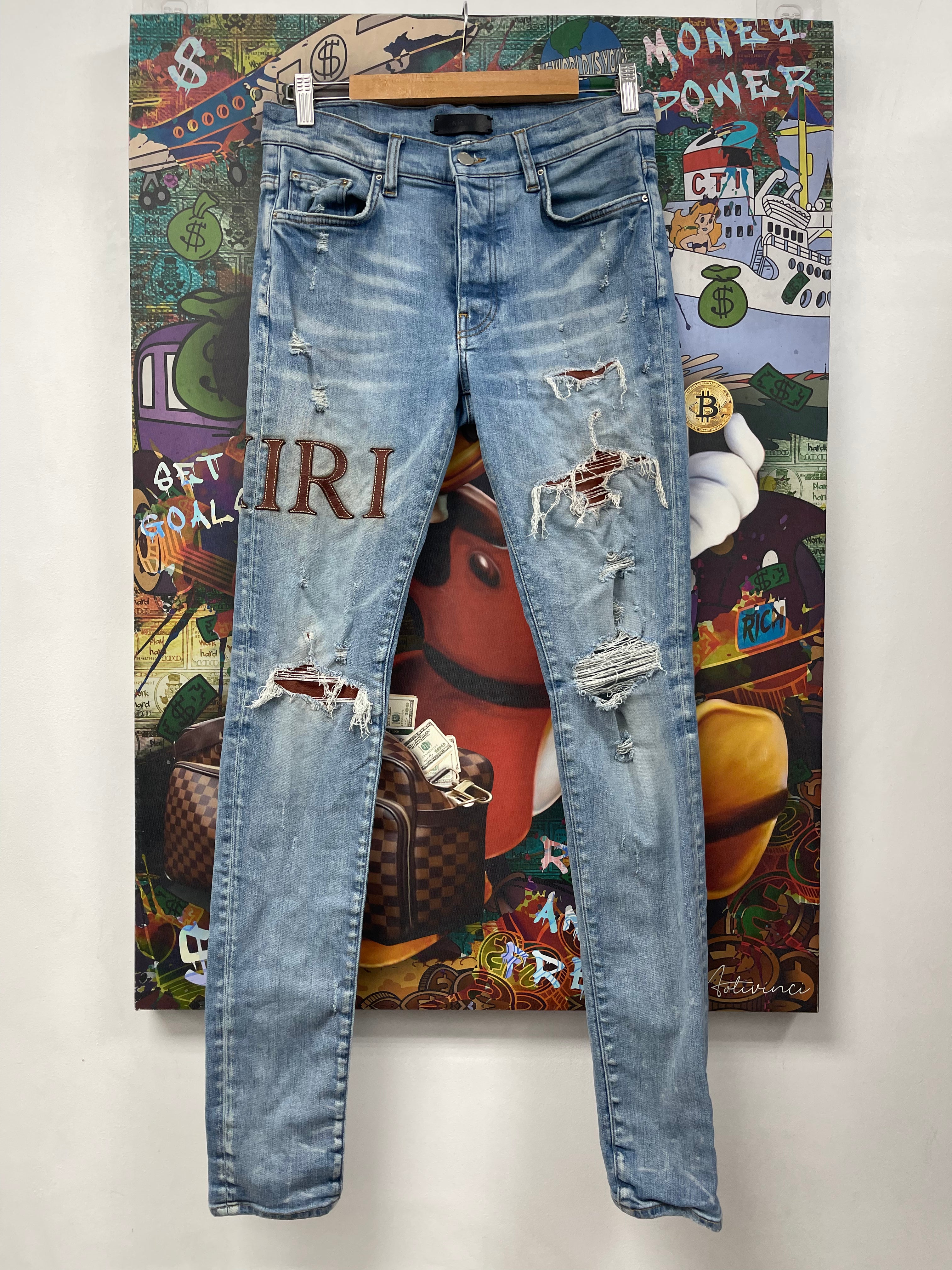Amiri Light Wash Clay Side Logo Jeans