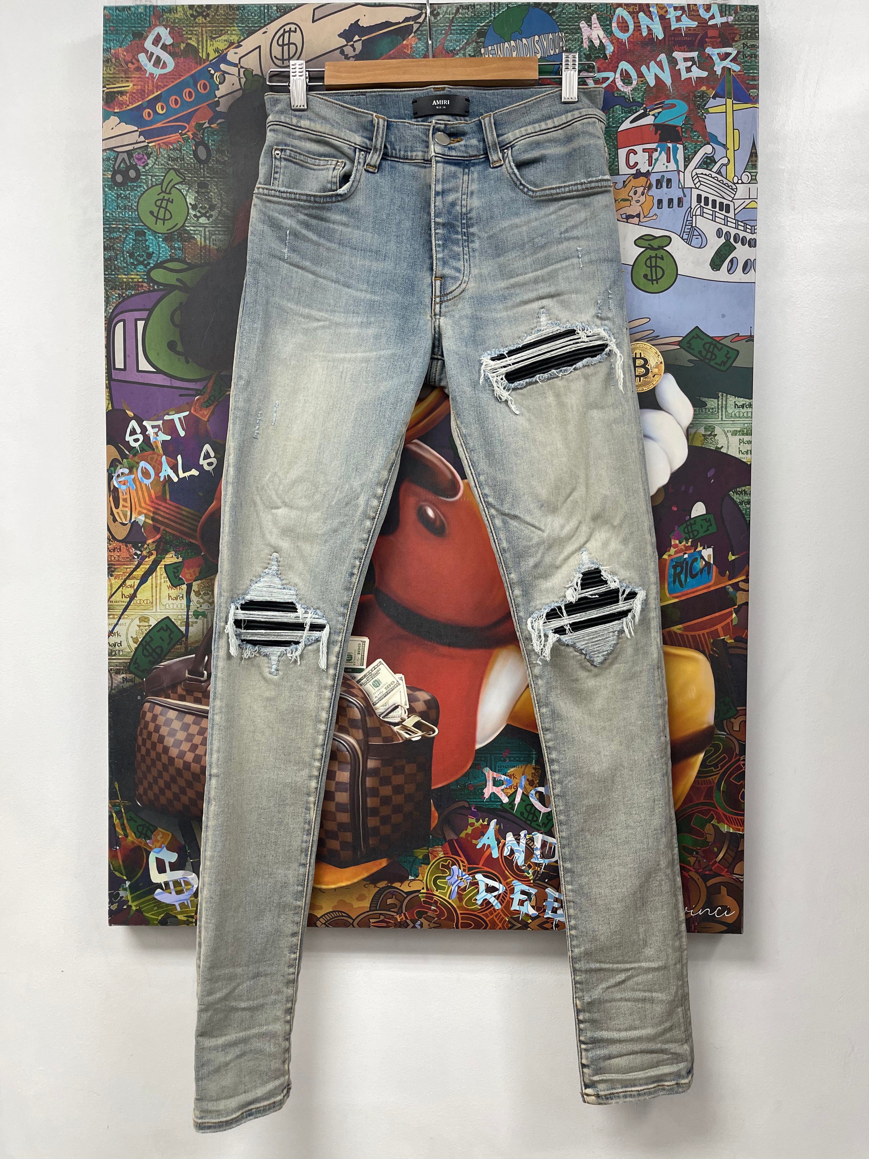 Amiri MX1 Light Wash Black Patch Jeans