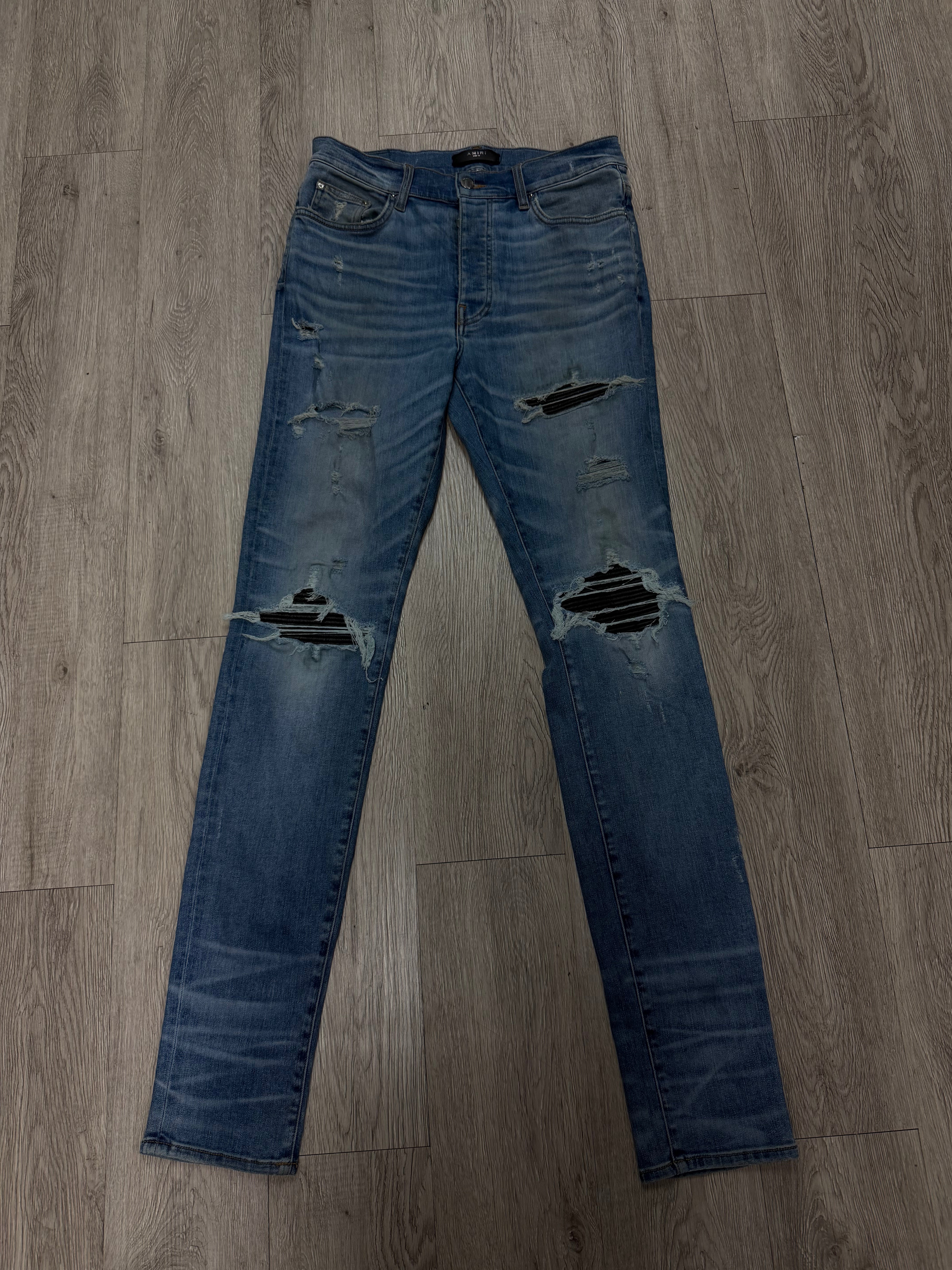 Amiri MX1 Light Wash Black Patch Jeans