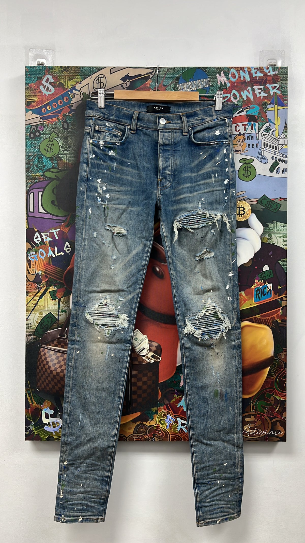 Amiri MX1 Light Wash Denim Splatter Patch Jeans