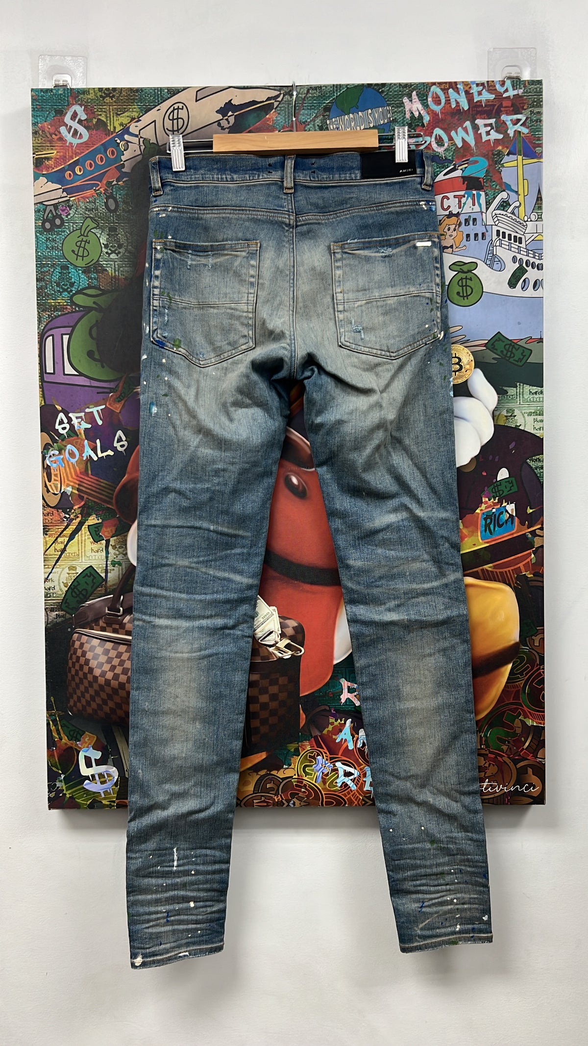 Amiri MX1 Light Wash Denim Splatter Patch Jeans