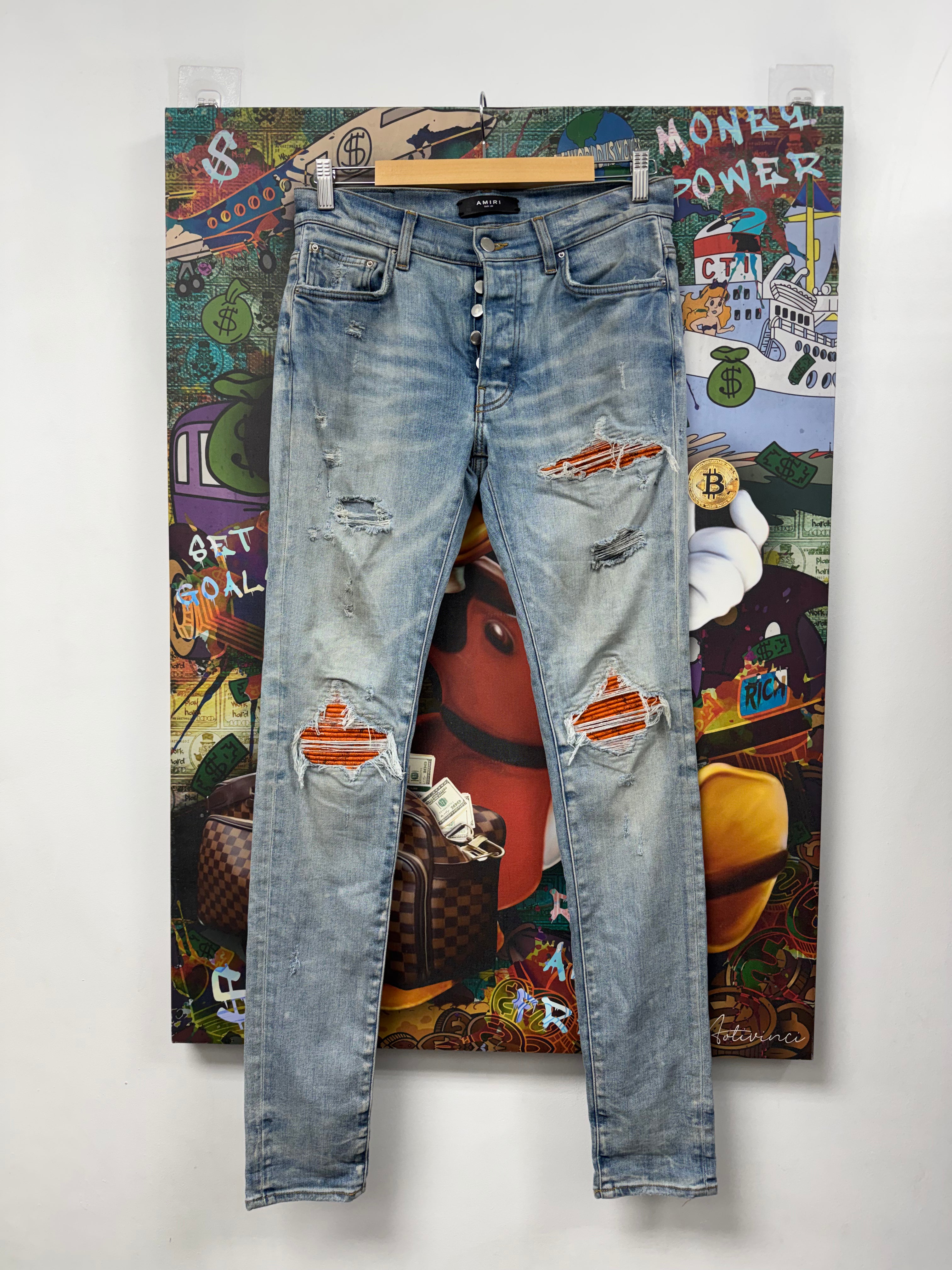Amiri MX1 Light Wash Orange Crackle Patch Jeans