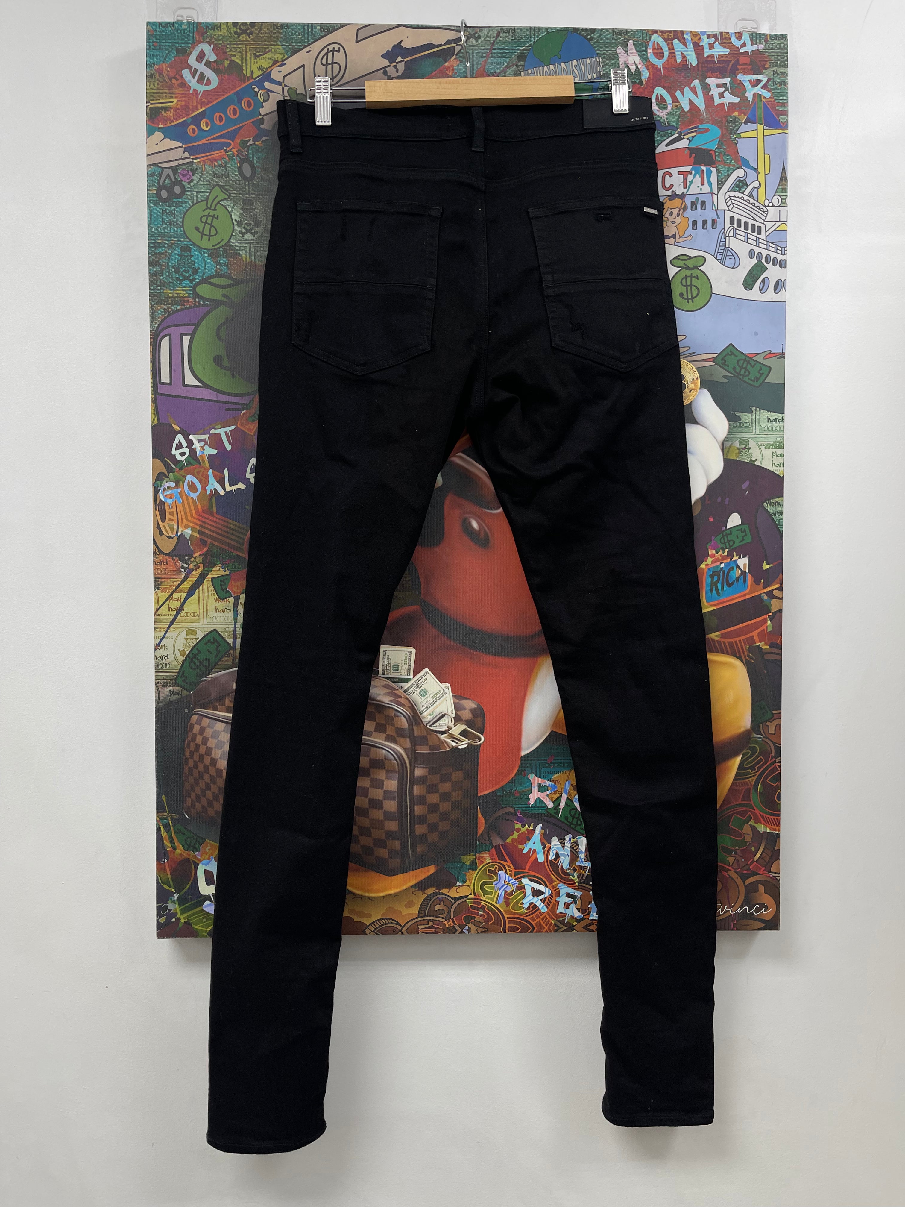 Amiri Black Knee Ripped Jeans