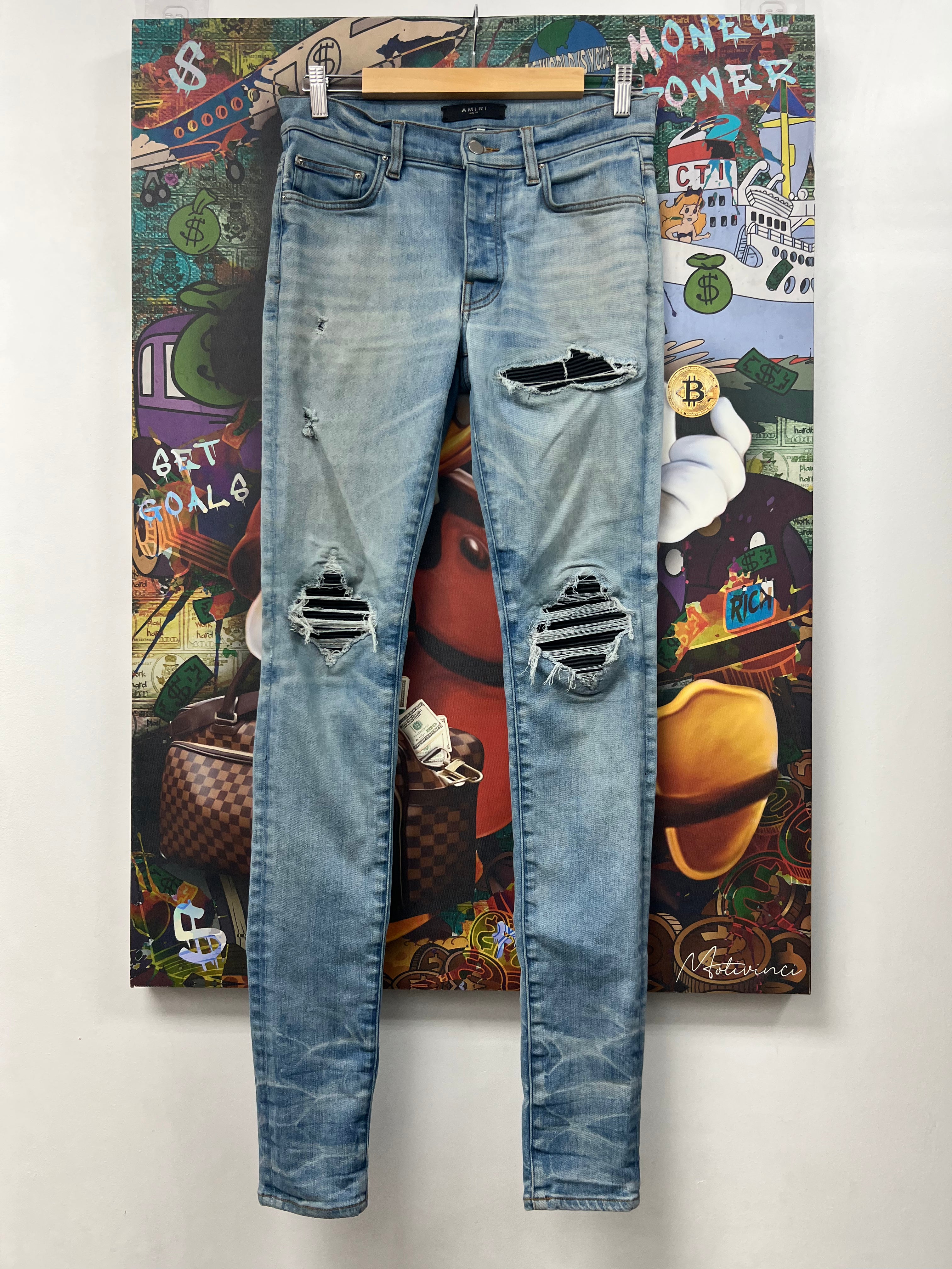 Amiri MX1 Light Wash Black Patch Jeans