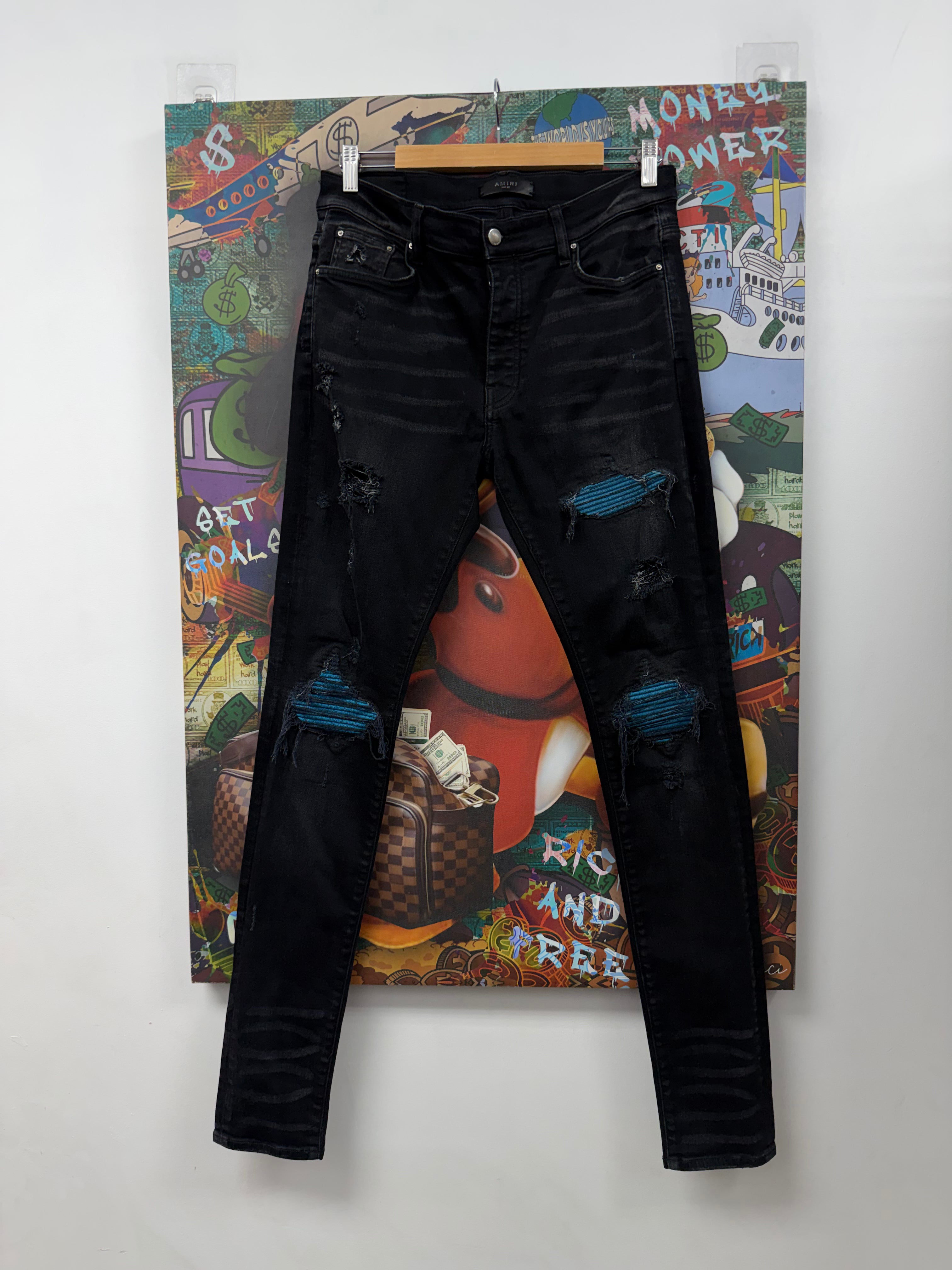 Amiri MX1 Black Wash Blue Crackle Patch Jeans