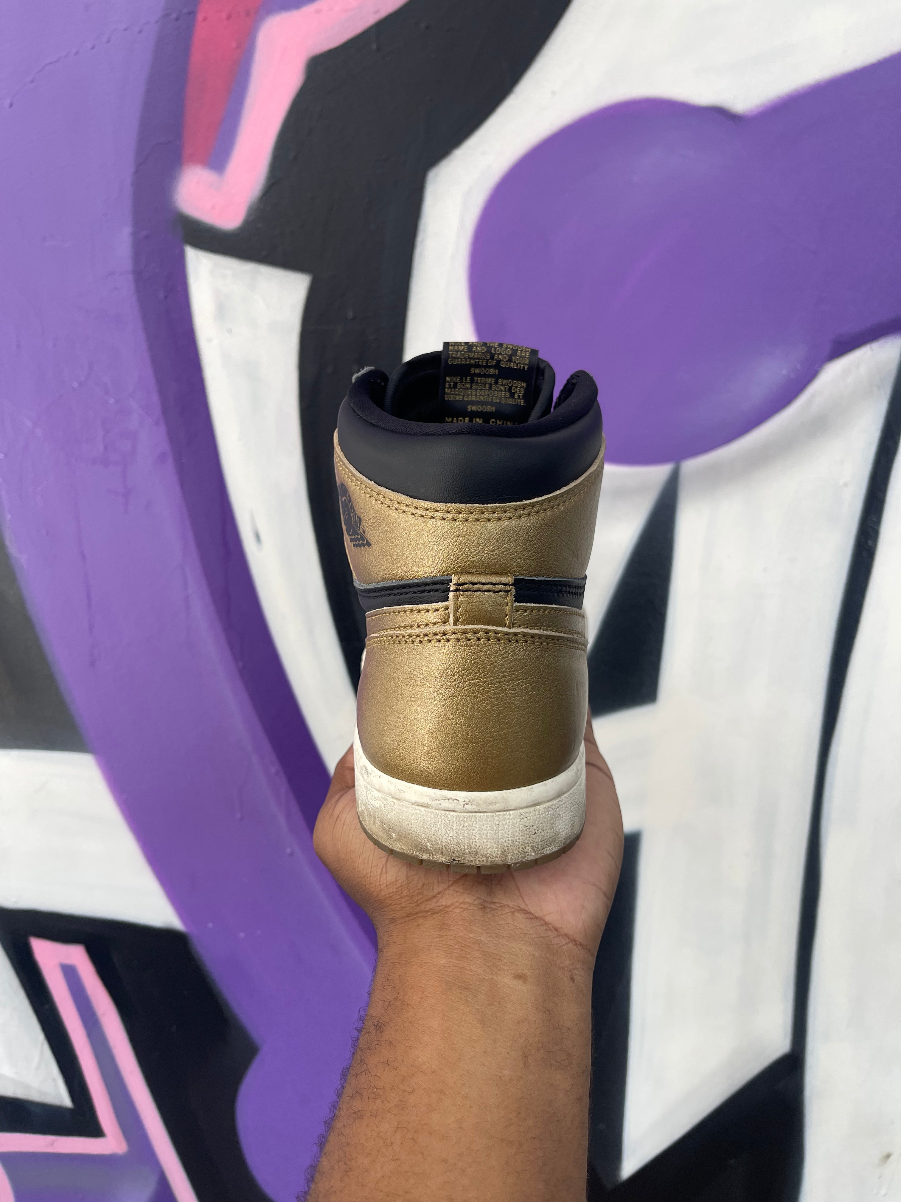 Jordan 1 Black Metallic Gold Sneakers
