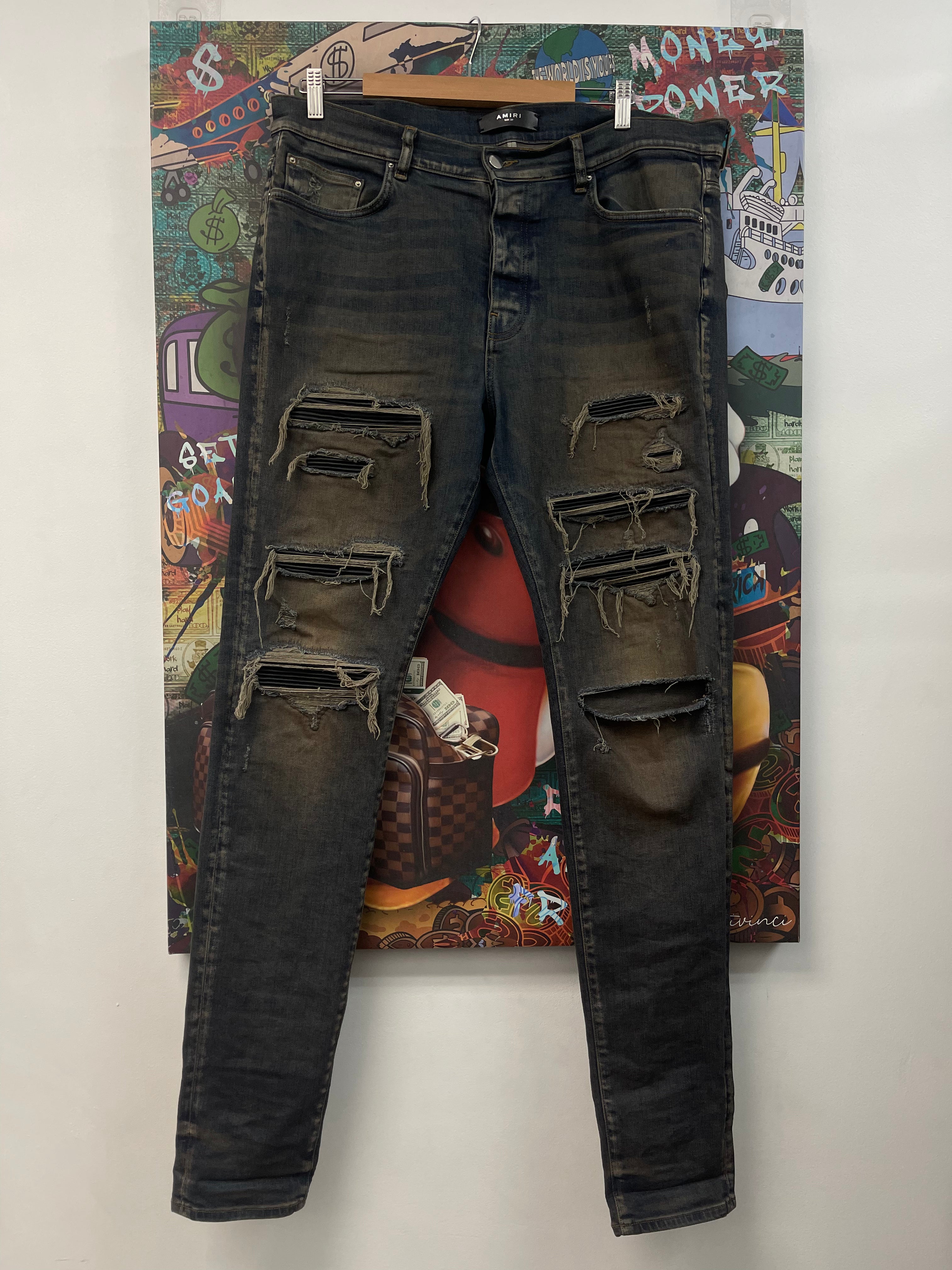 Amiri Rust Wash Black Thrasher Patch Jeans