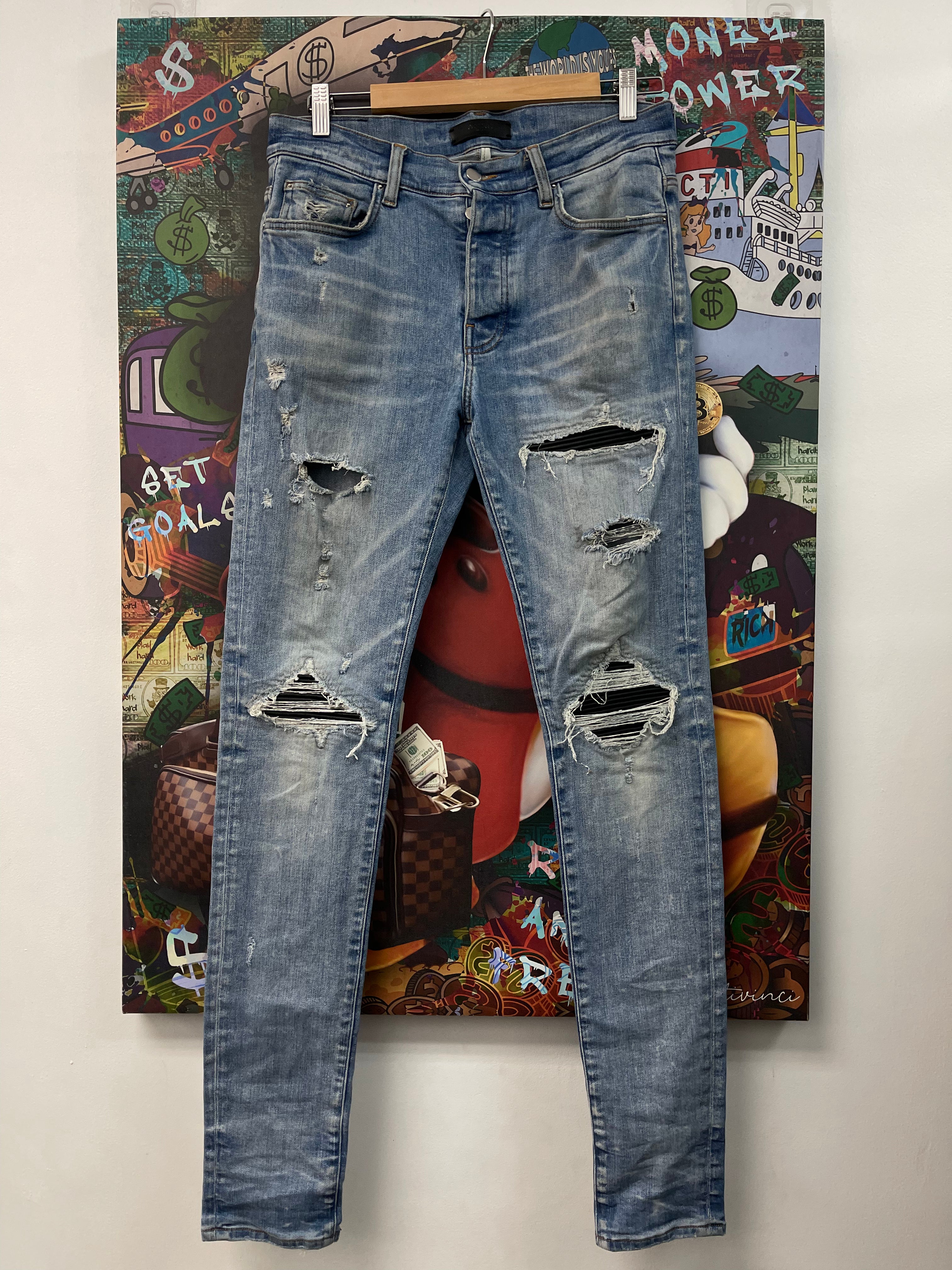 Amiri Light Wash Black Patch MX1 Jeans