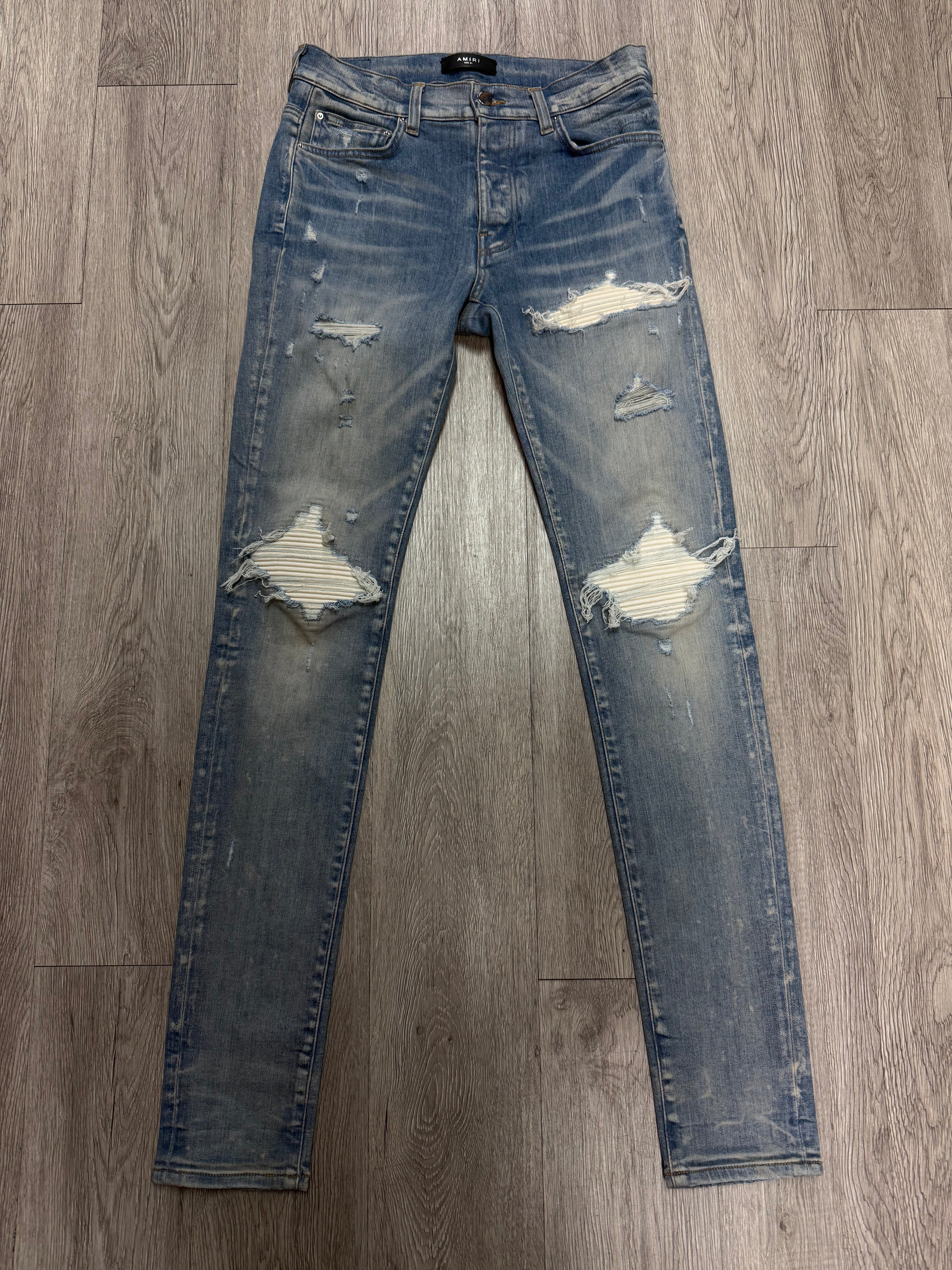 Amiri MX1 Light Wash White Suede Patch Jeans