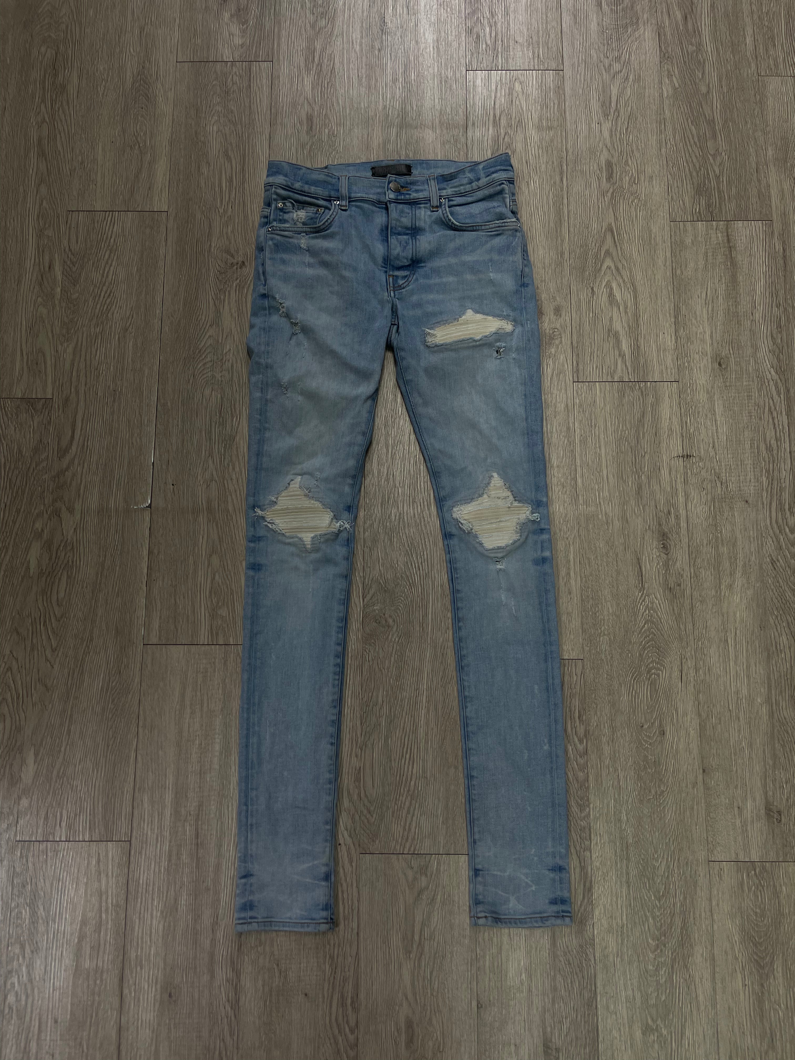 Amiri Light Wash White Patch Jeans