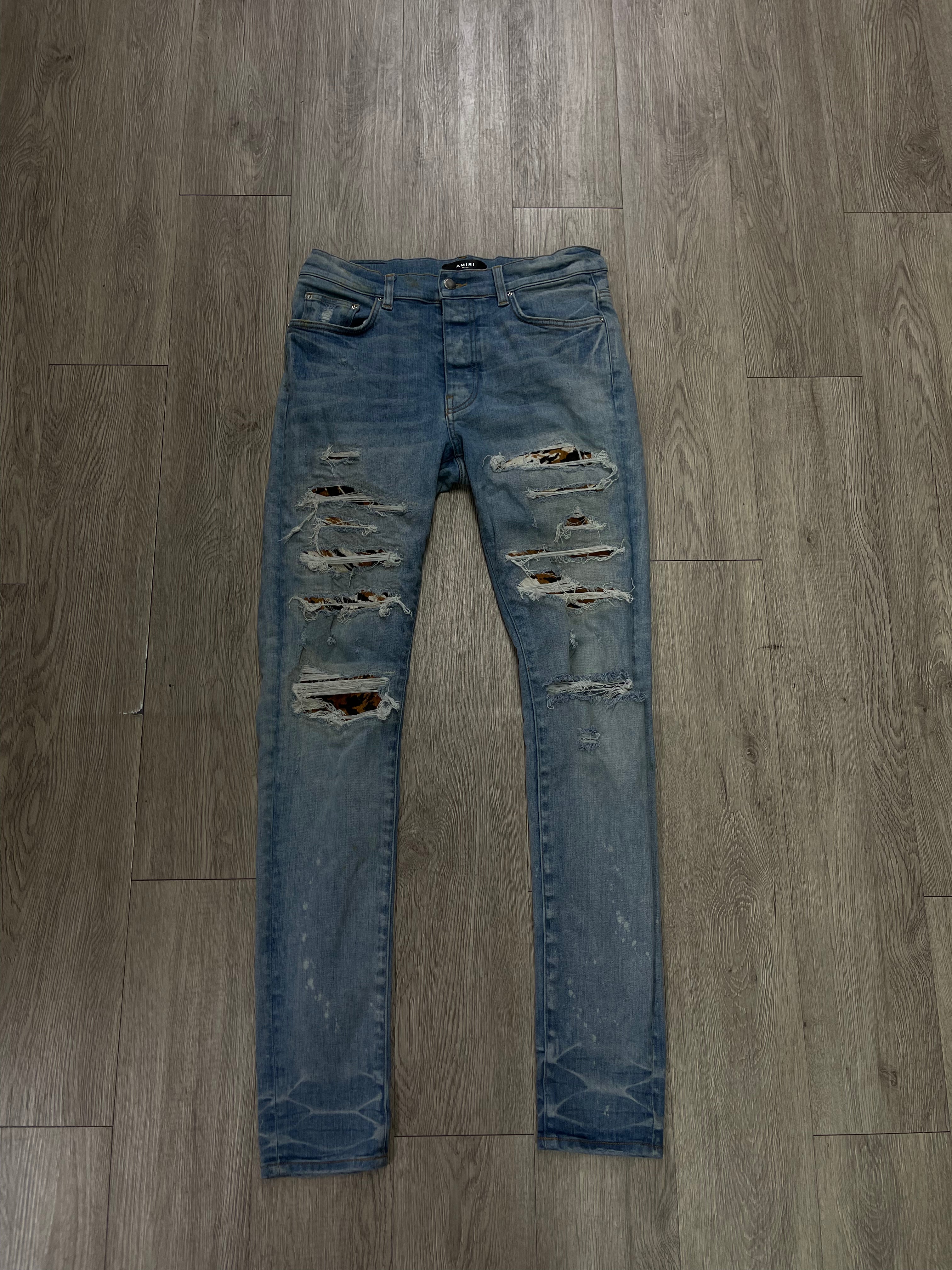 Amiri Light Wash Cow Hide Cheetah Thrasher Jeans