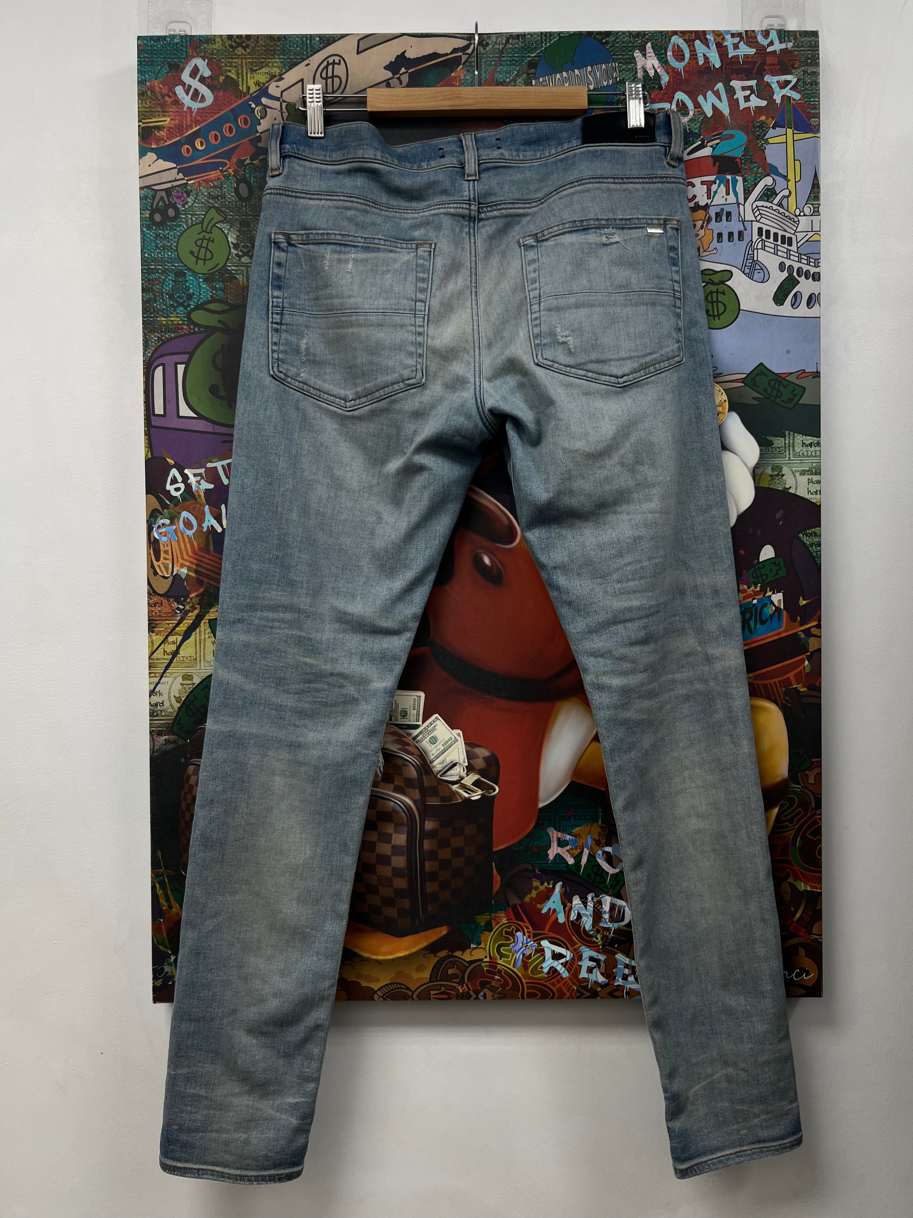 Amiri MX1 Light Wash White Patch Jeans