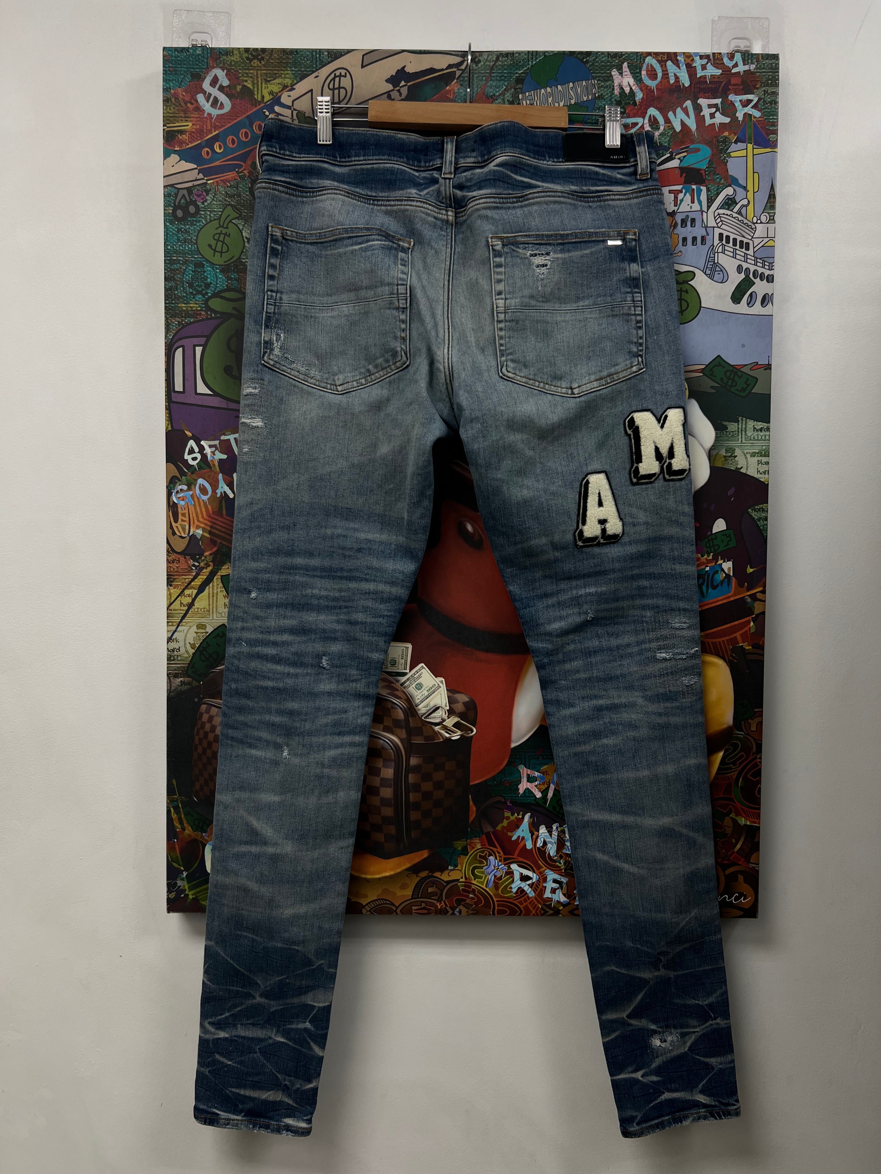Amiri Light Wash Varsity Patch Jeans