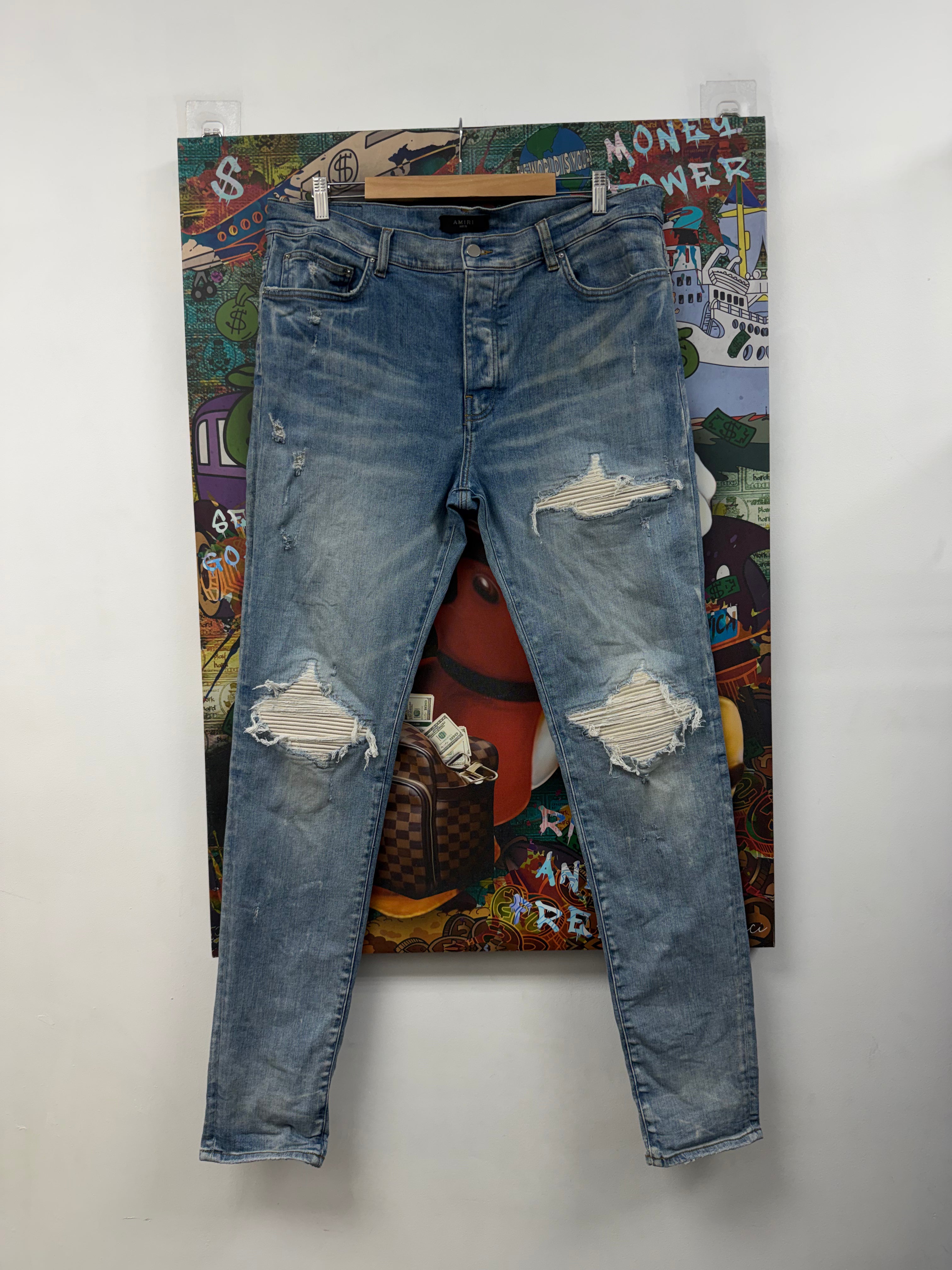 Amiri MX1 Light Wash White Patch Jeans