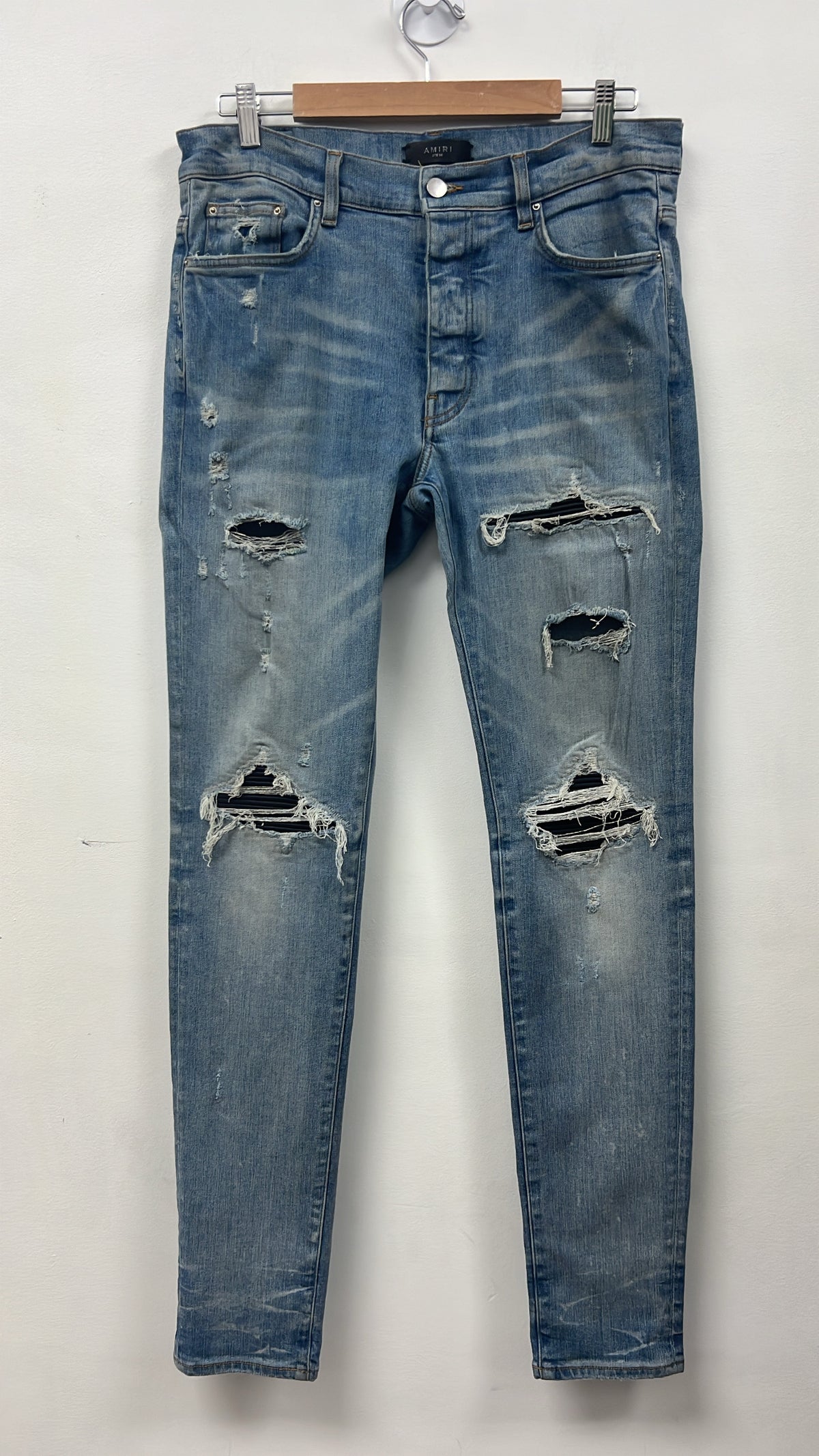 Amiri MX1 Light Wash Black Leather Patch Jeans