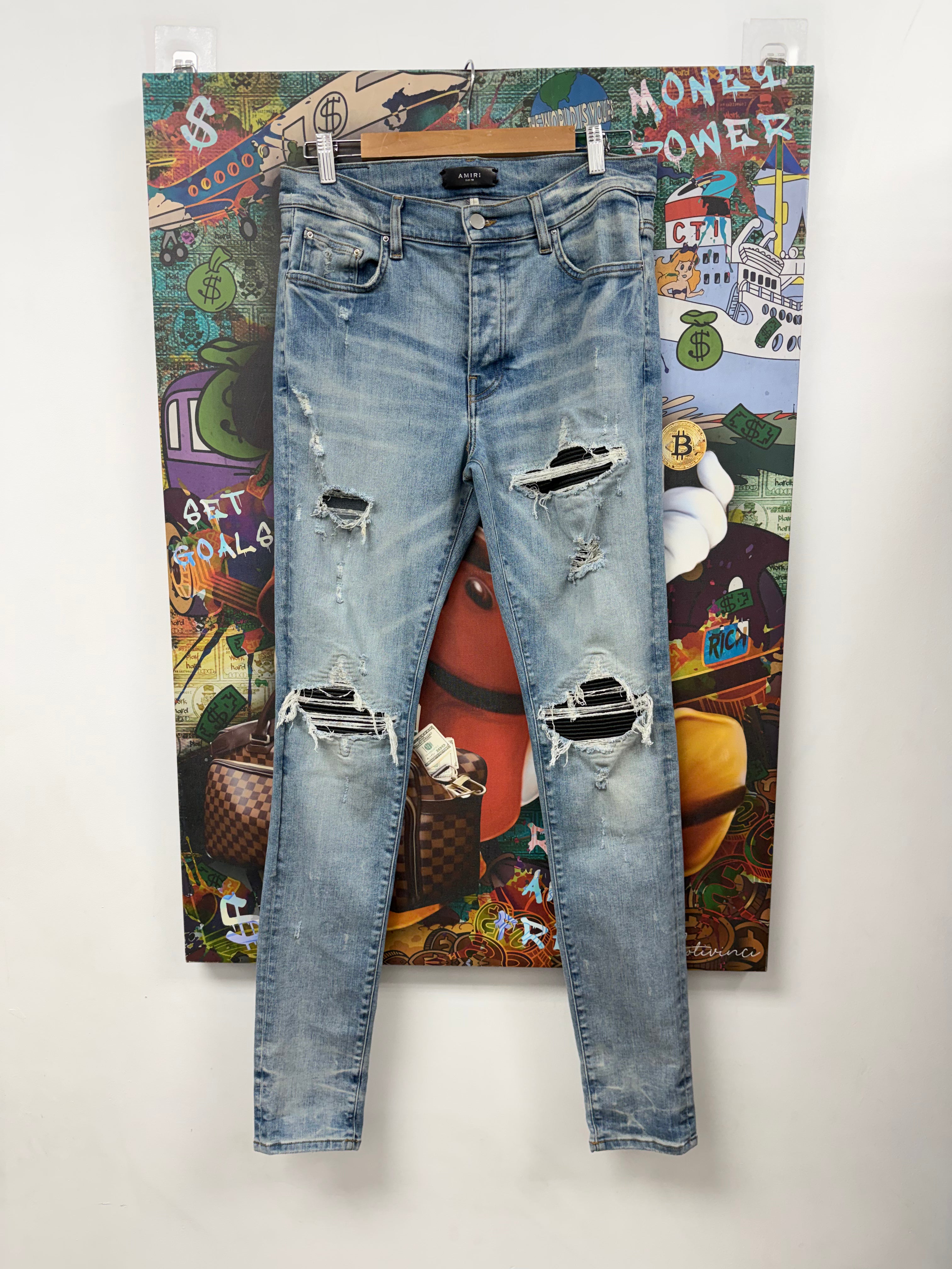 Amiri MX1 Light Wash Black Leather Patch Jeans