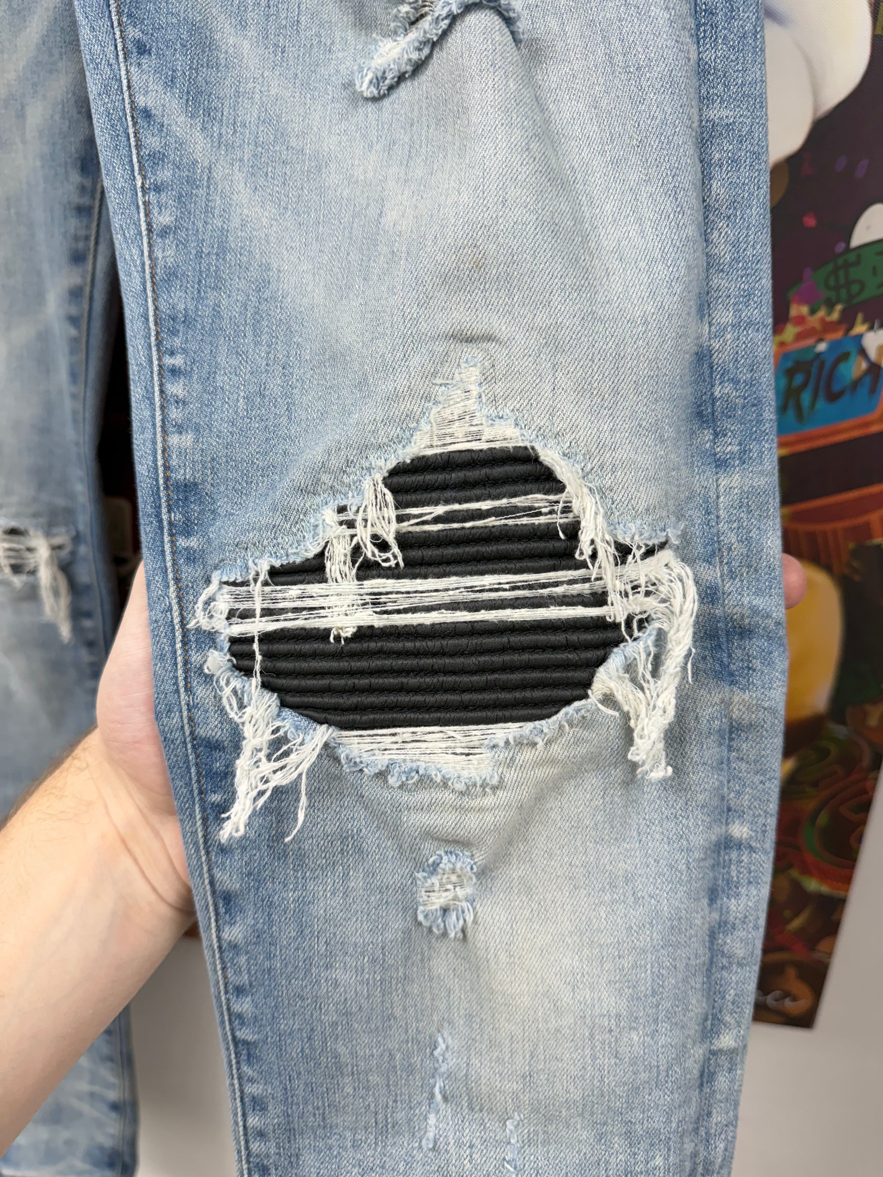 Amiri MX1 Light Wash Black Leather Patch Jeans