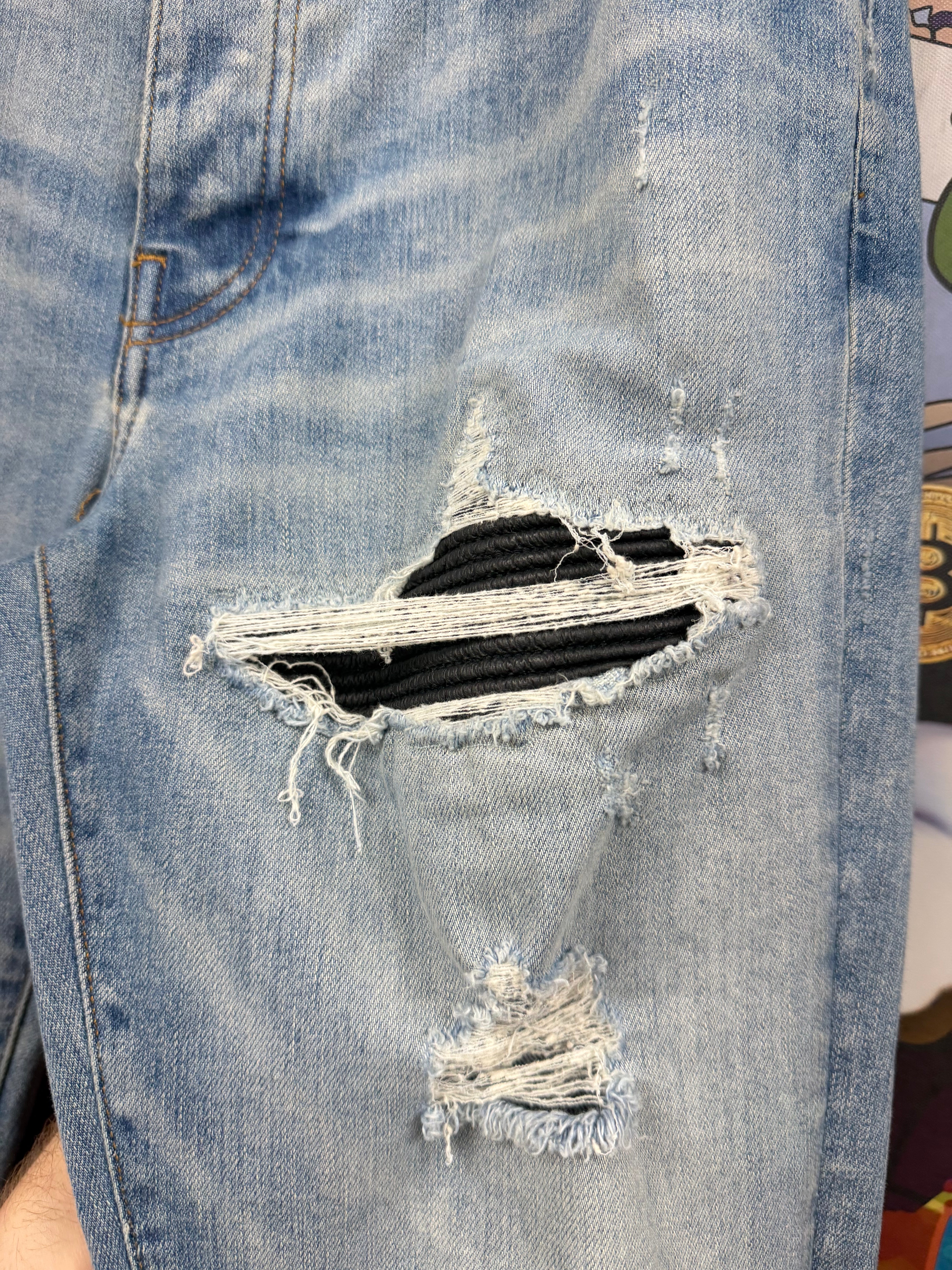 Amiri MX1 Light Wash Black Leather Patch Jeans