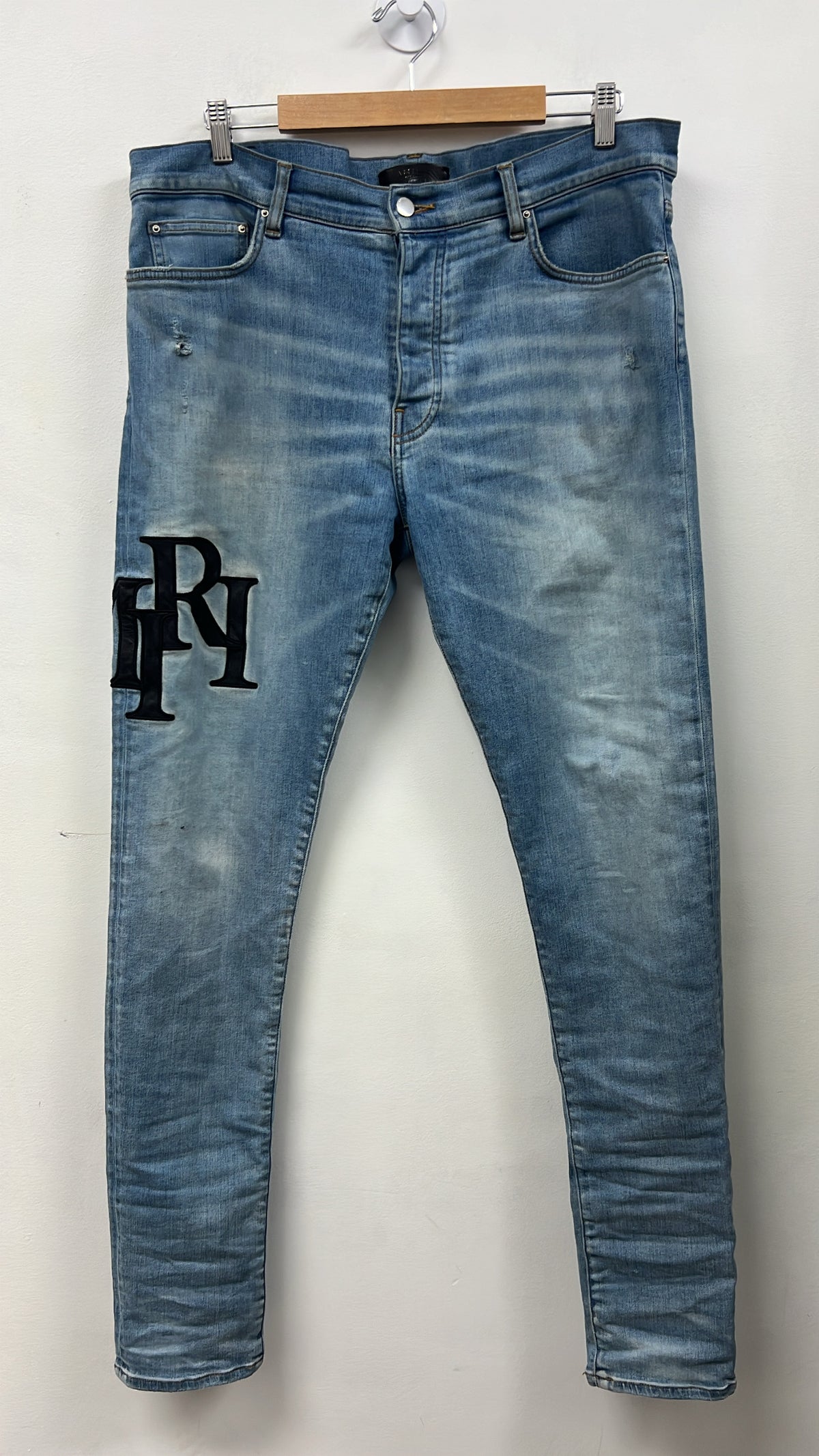 Amiri Light Wash Staggered Side Logo Jeans