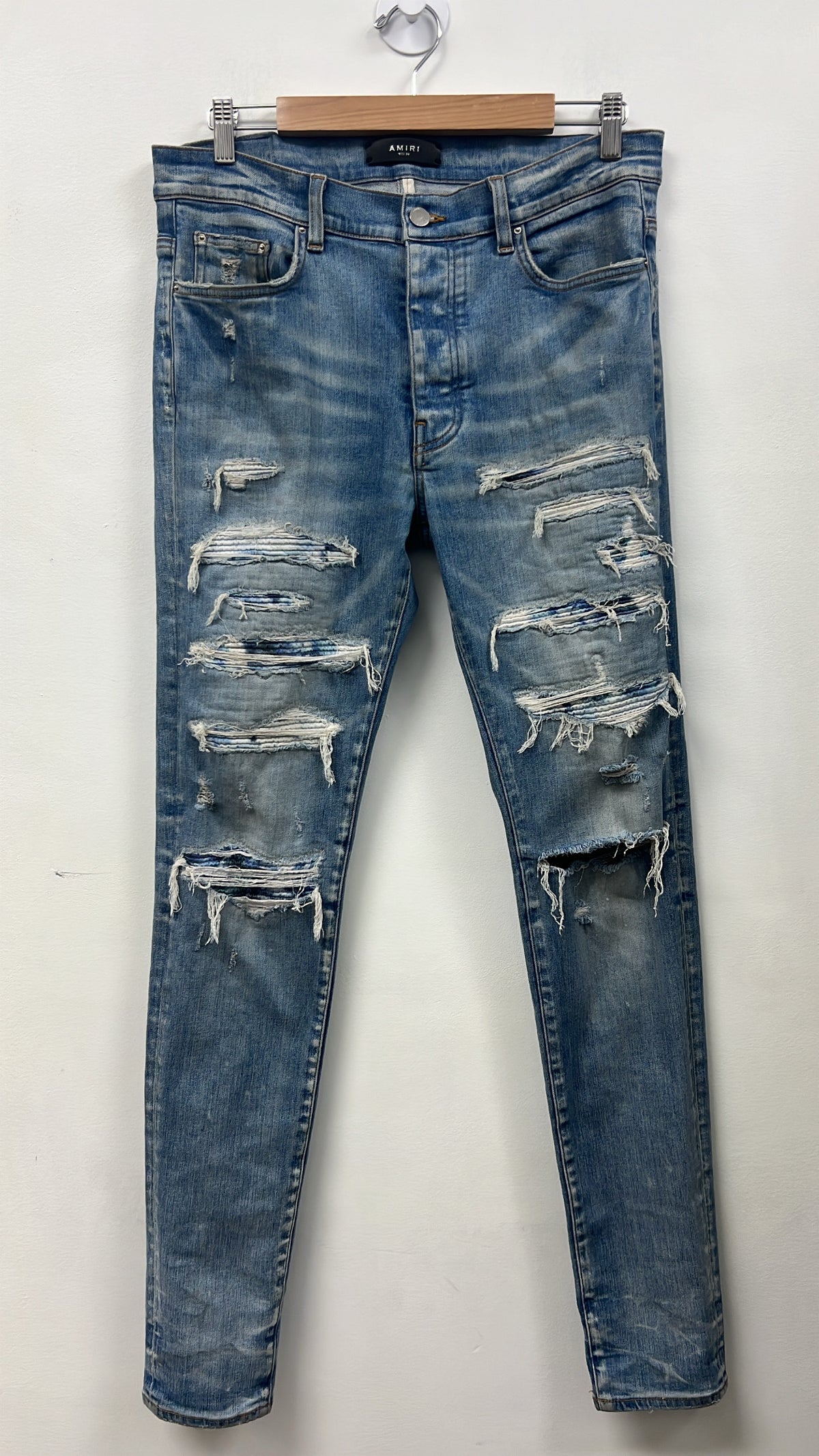Amiri Light Wash Tie Dye Thrasher Patch Jeans
