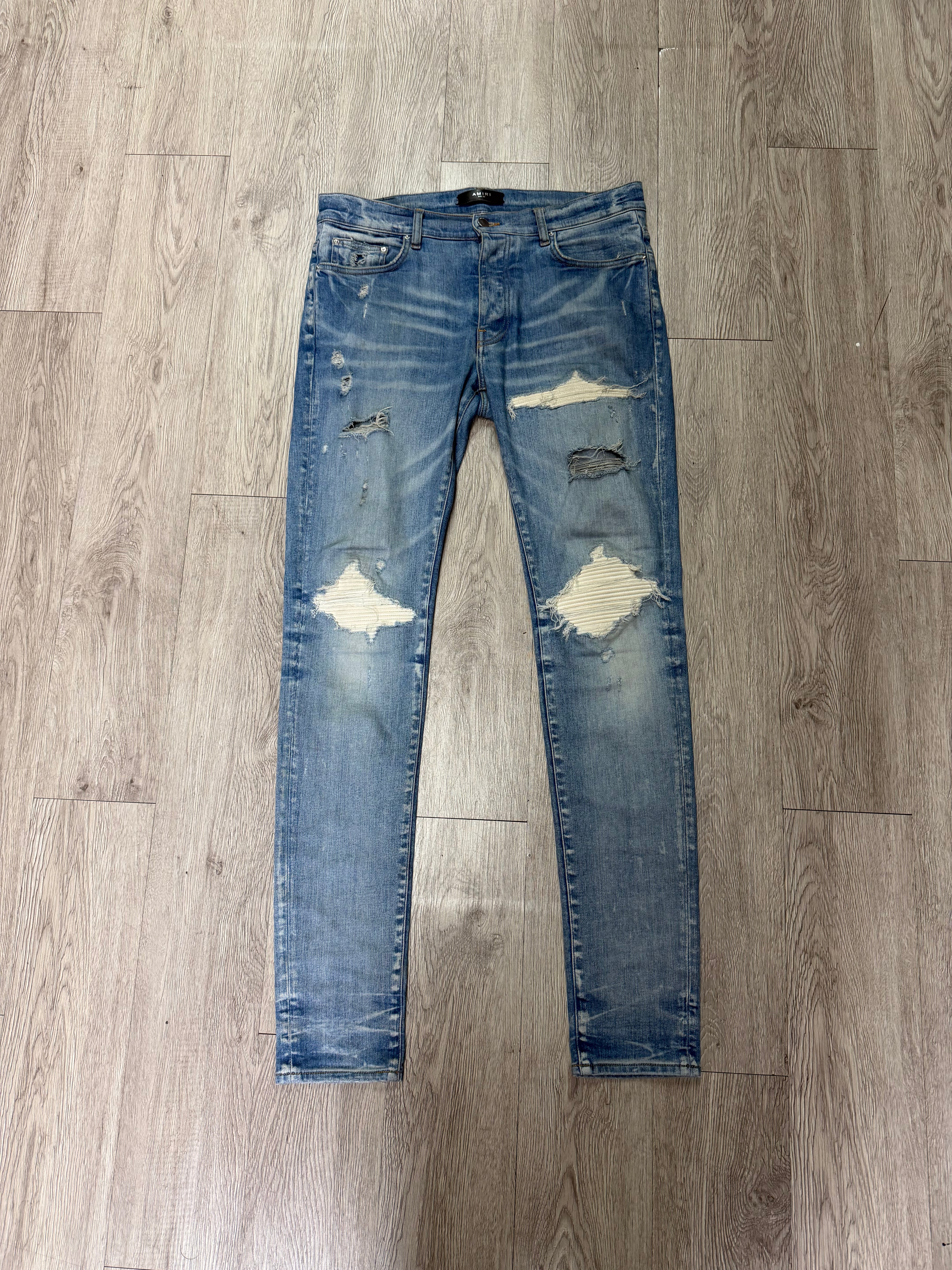 Amiri MX1 Light Wash White Patch Jeans