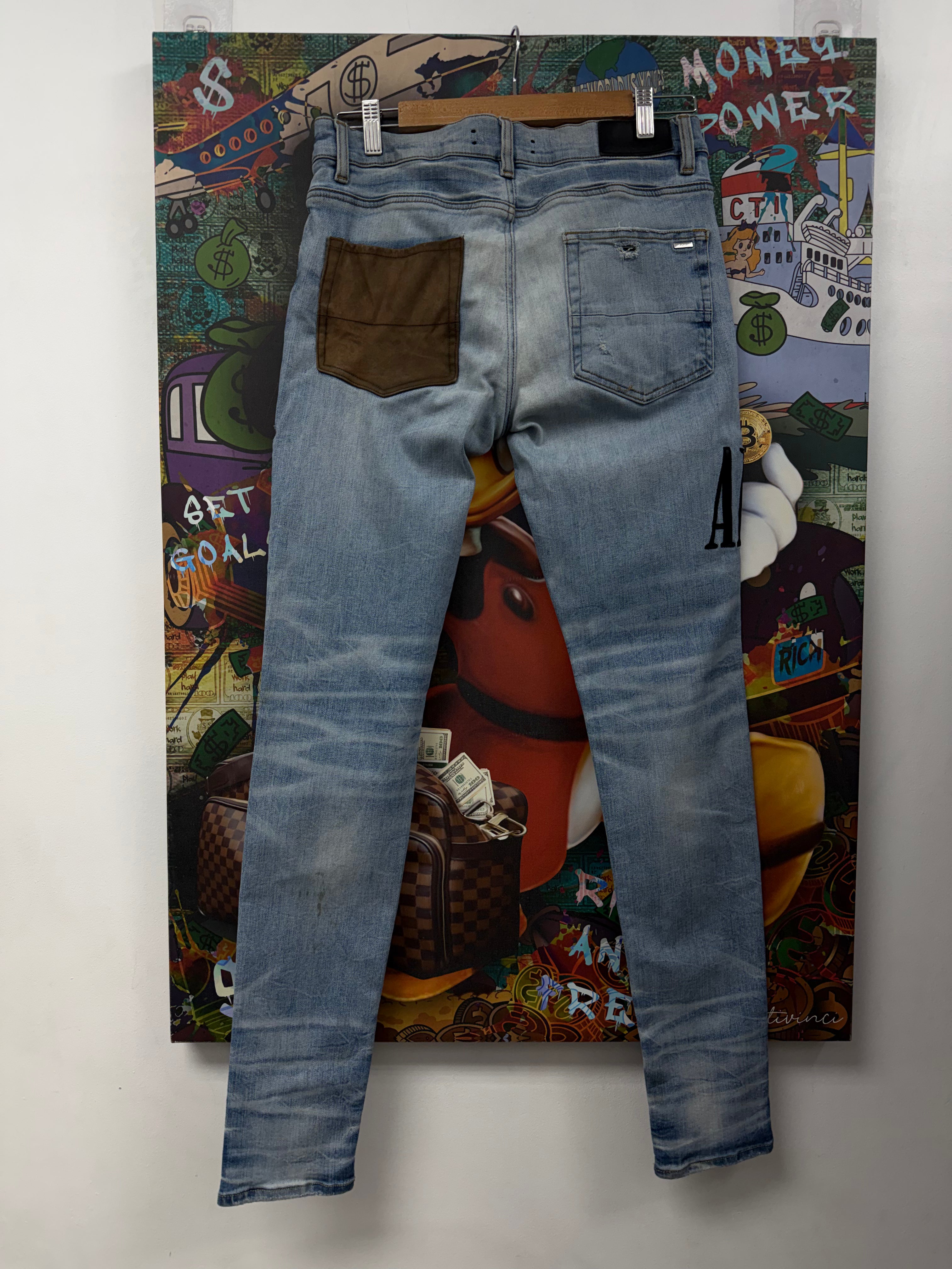 Amiri Light Wash Patchwork Jeans