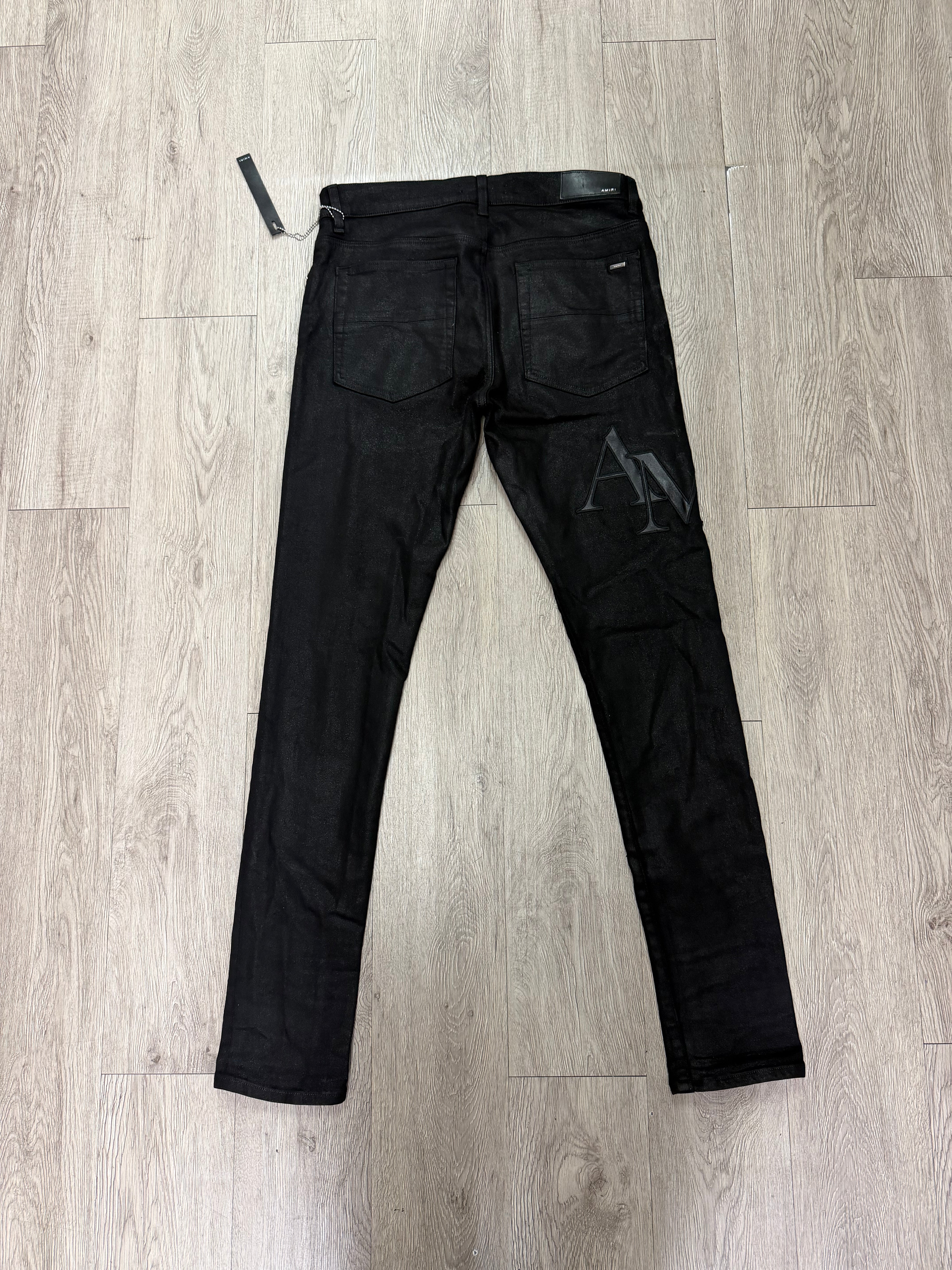 Amiri Black Wax Staggered Side Logo Jeans