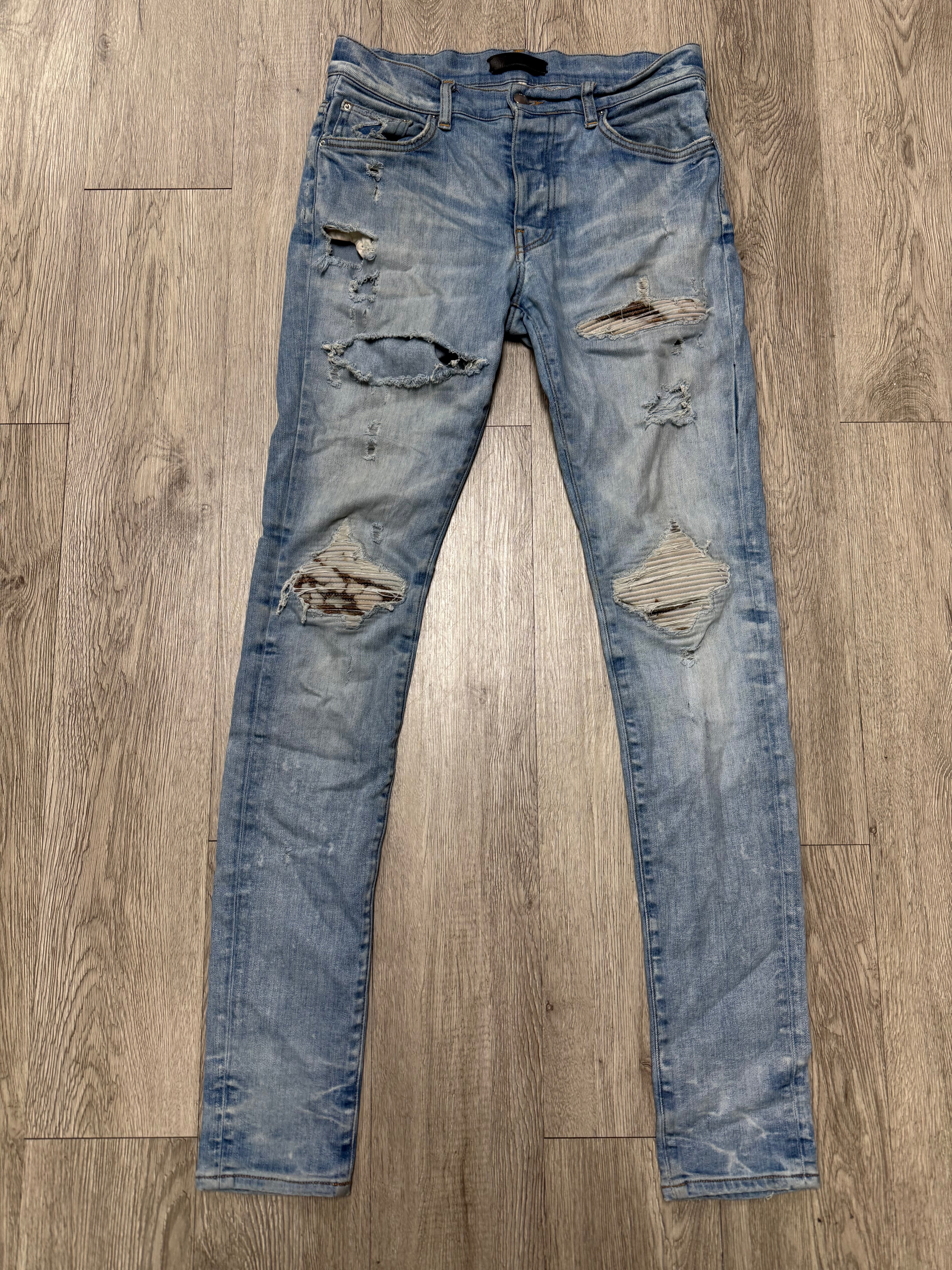 Amiri MX1 Light Wash Marble Patch Jeans