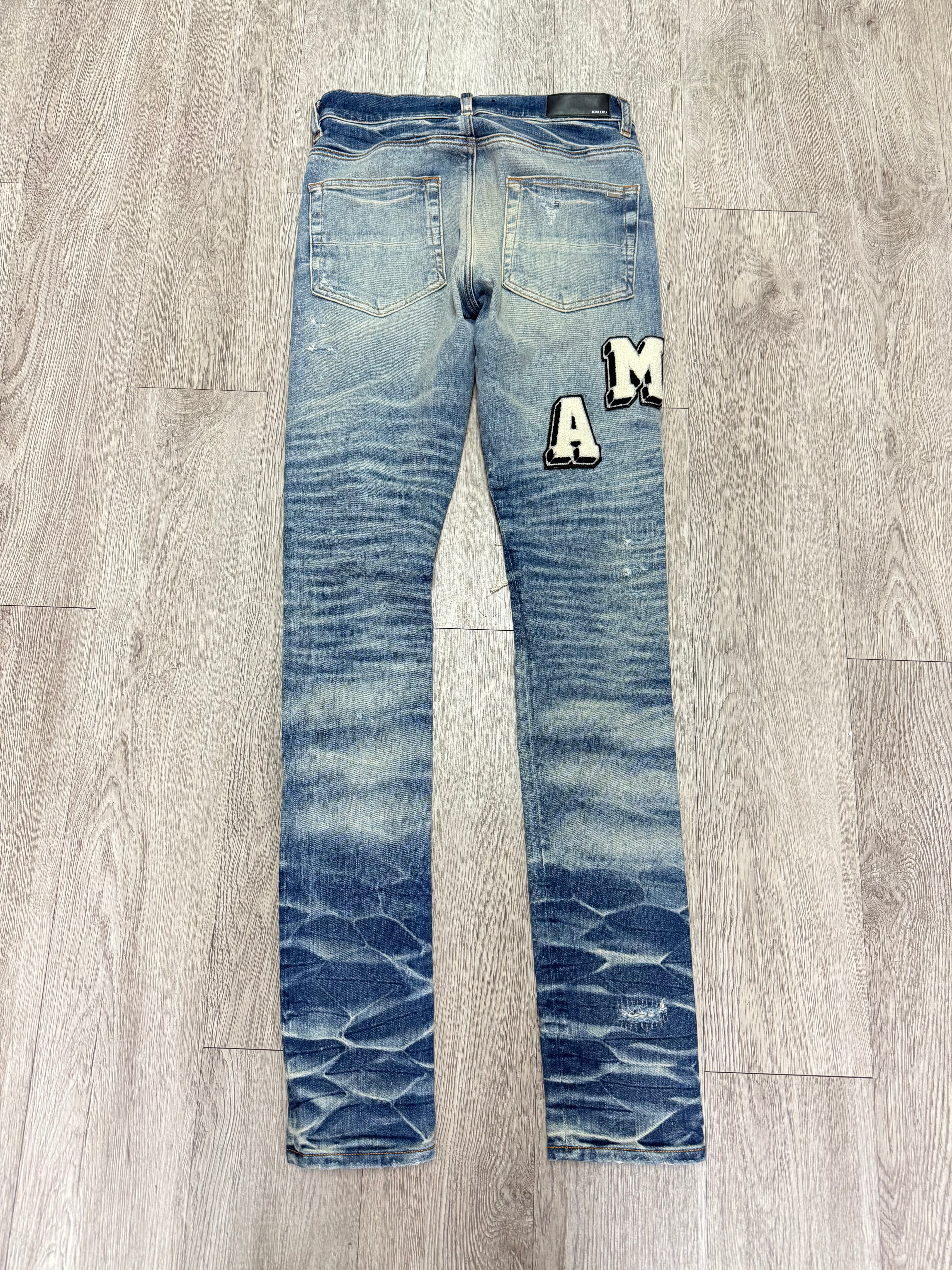Amiri Honeycomb Wash Distressed Varsity Logo Jeans