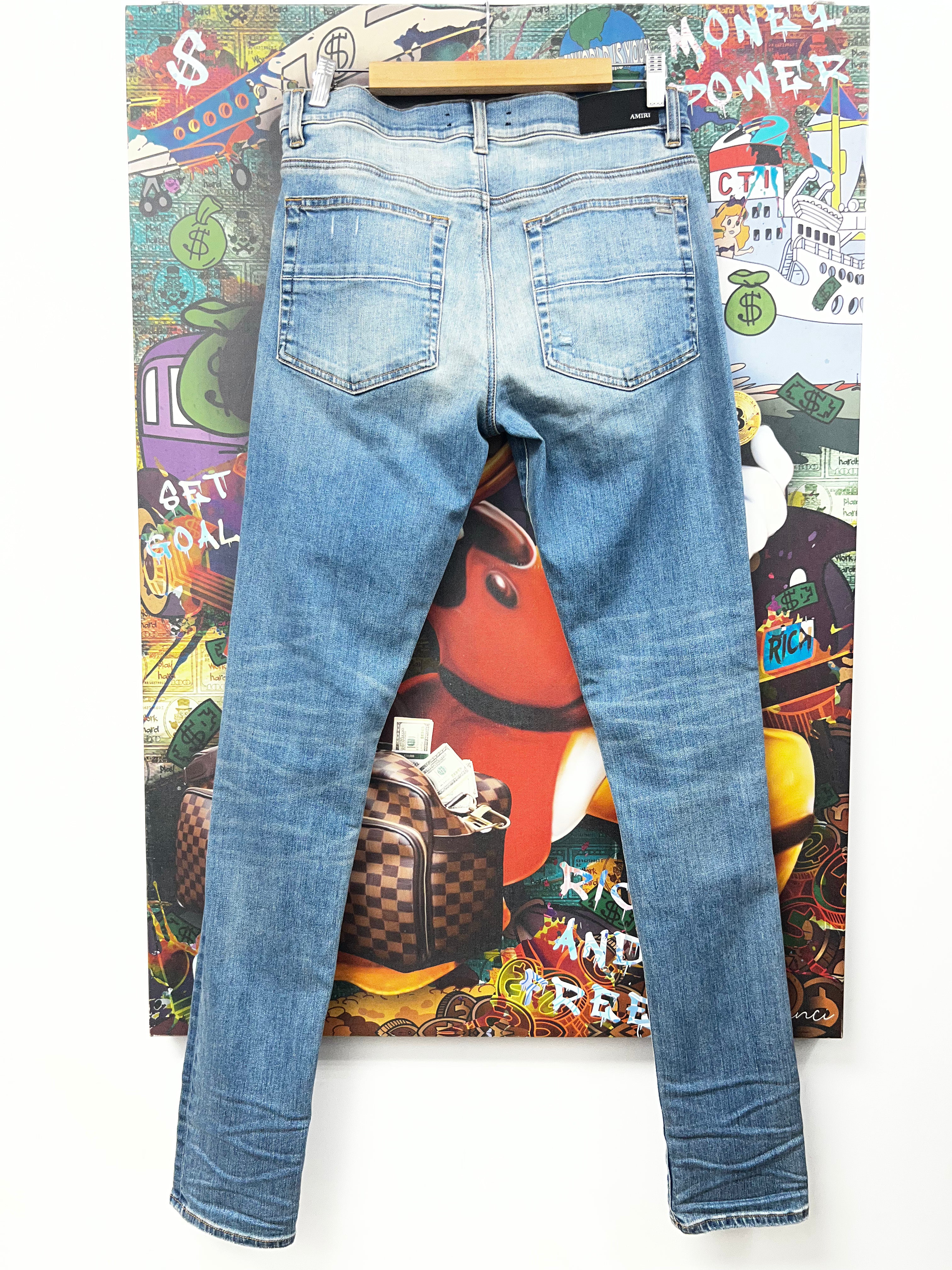 Amiri MX1 Light Wash Black Patch Jeans