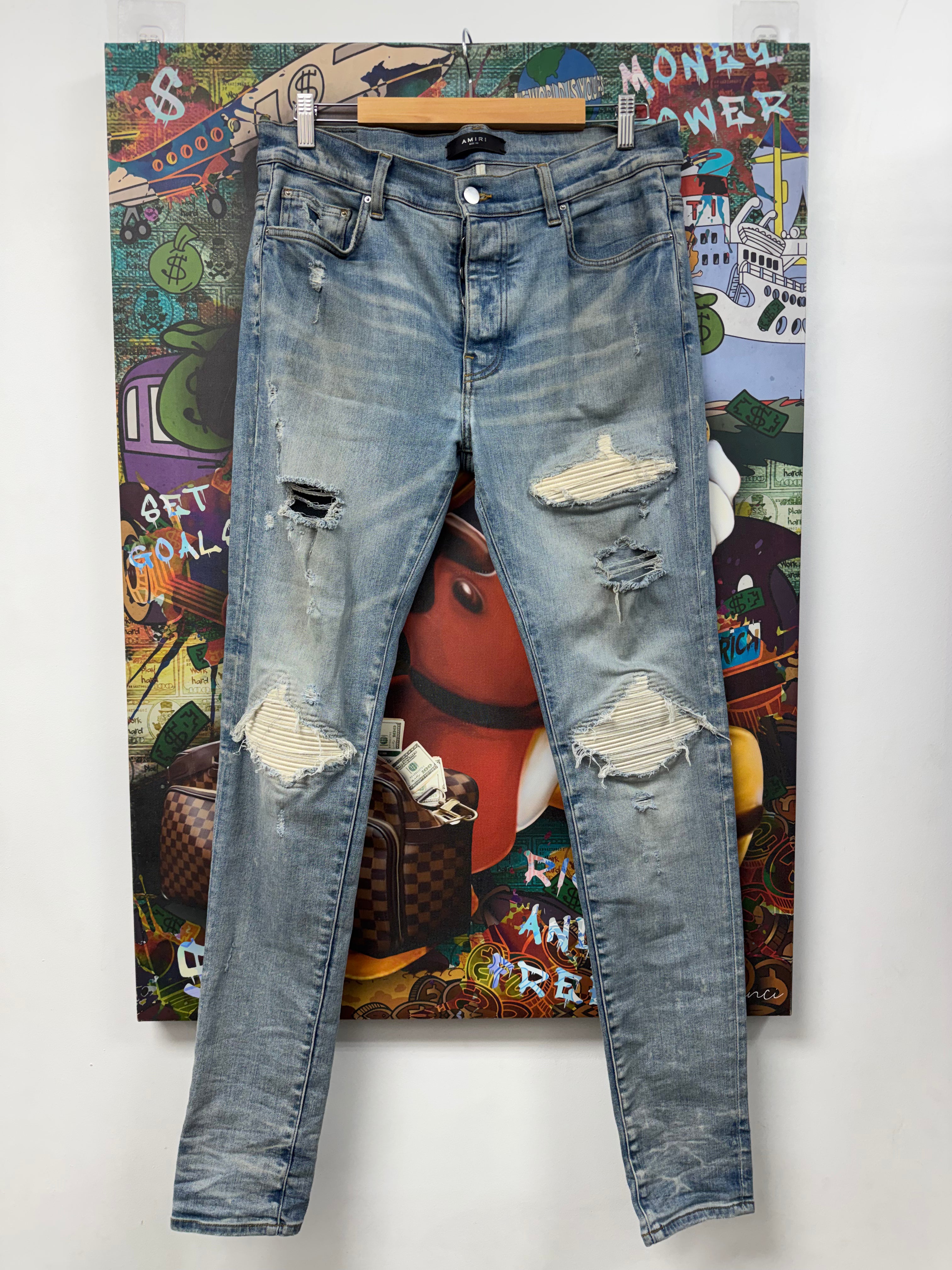 Amiri MX1 Light Wash White Suede Patch Jeans
