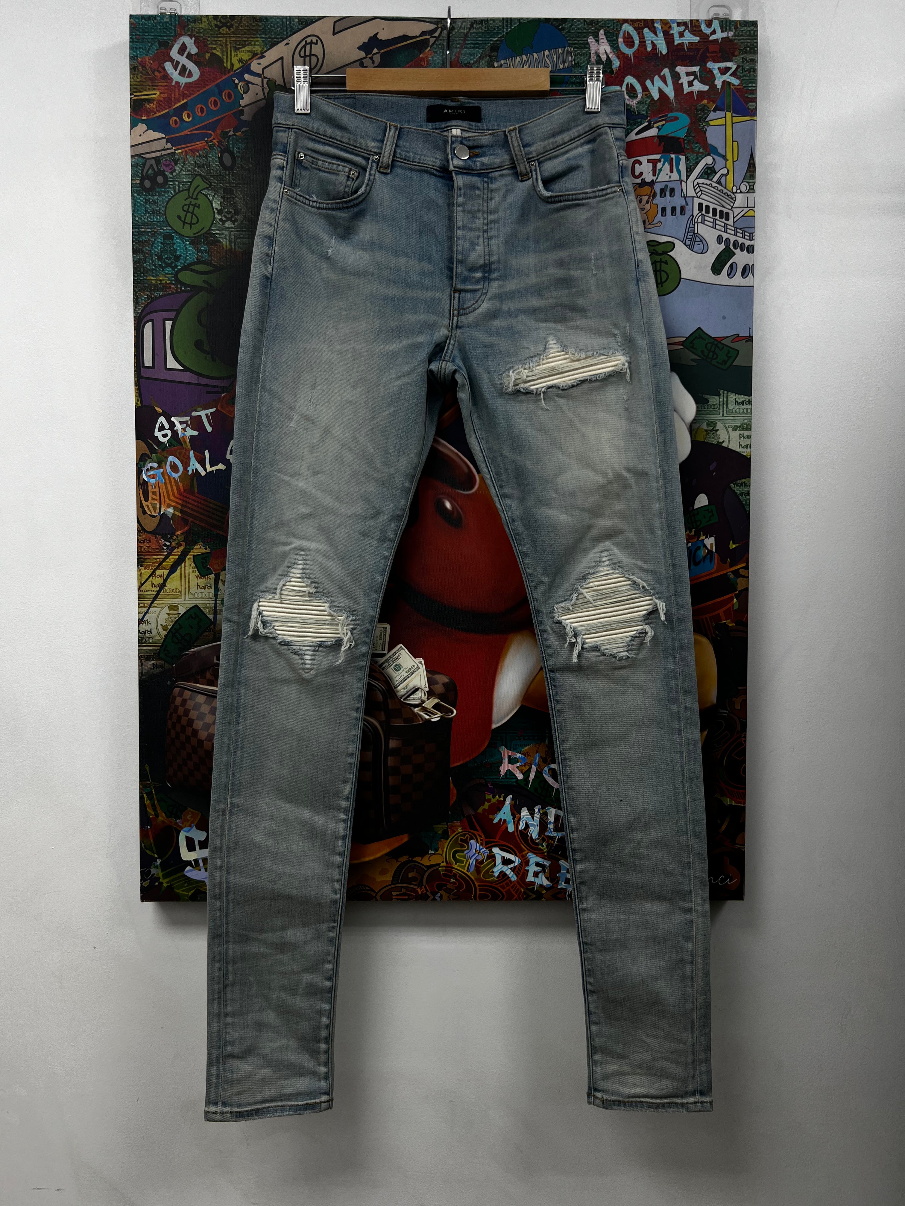 Amiri MX1 Light Wash White Patch Jeans