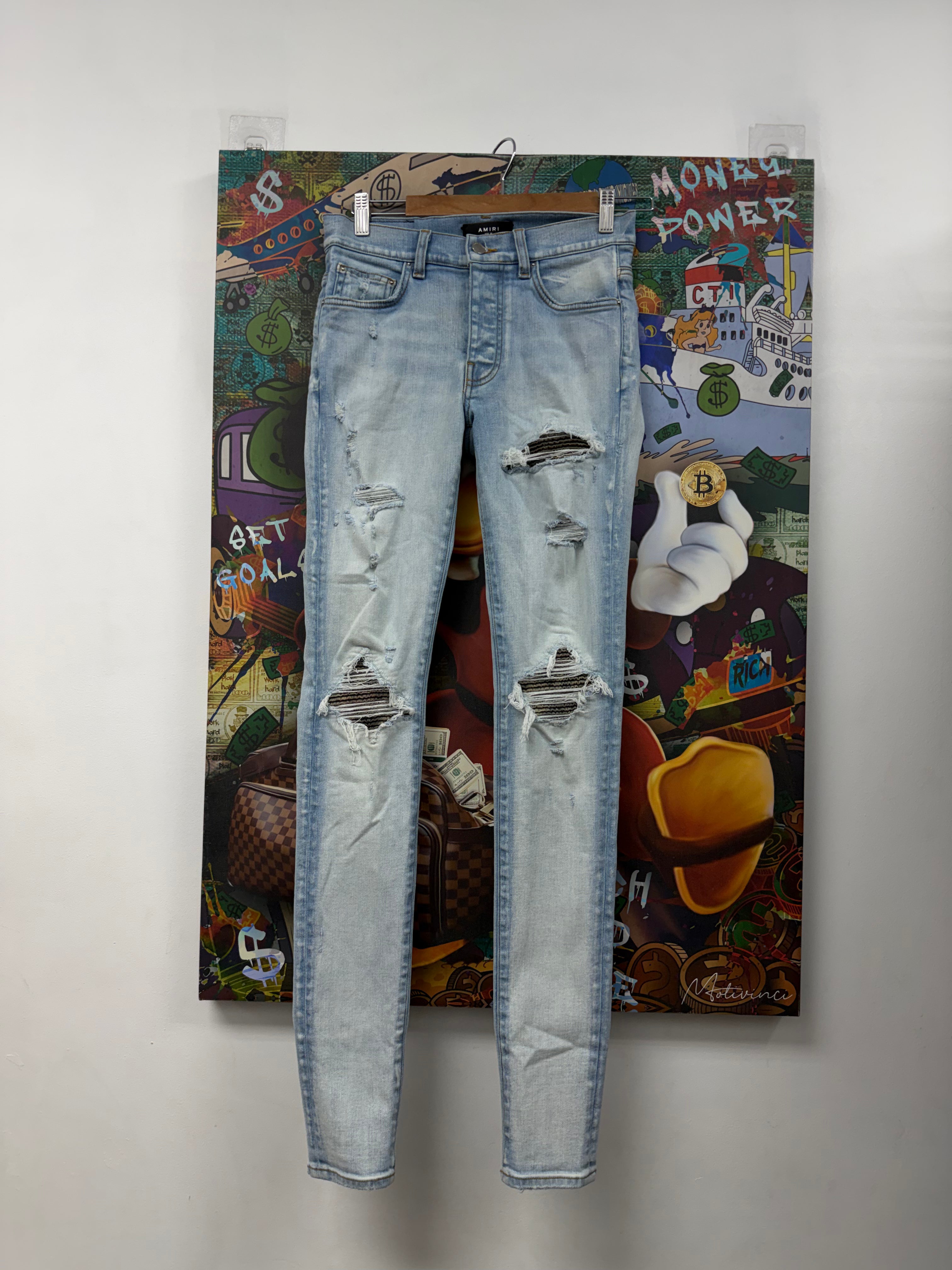 Amiri MX1 Light Wash Camo Patch Jeans