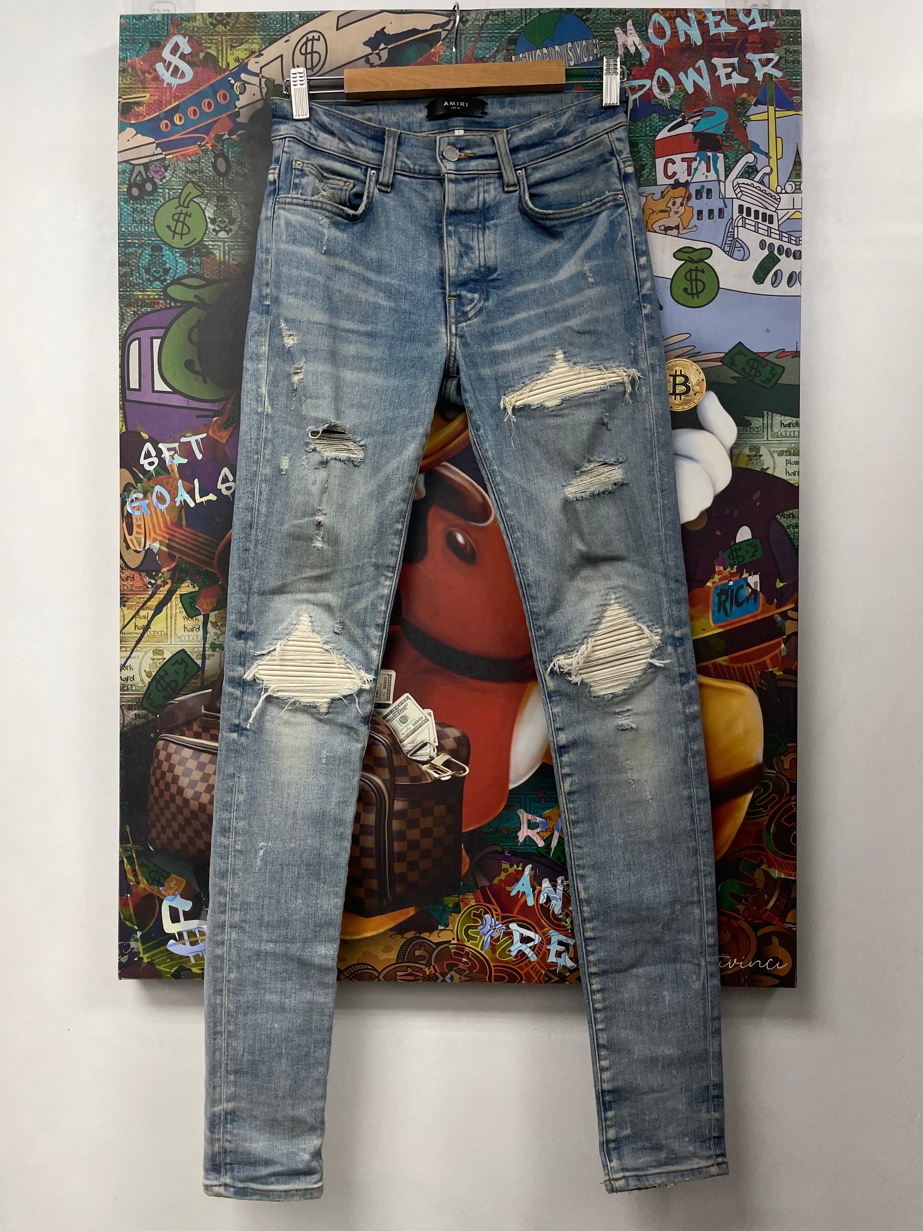 Amiri MX1 Light Wash White Patch Jeans