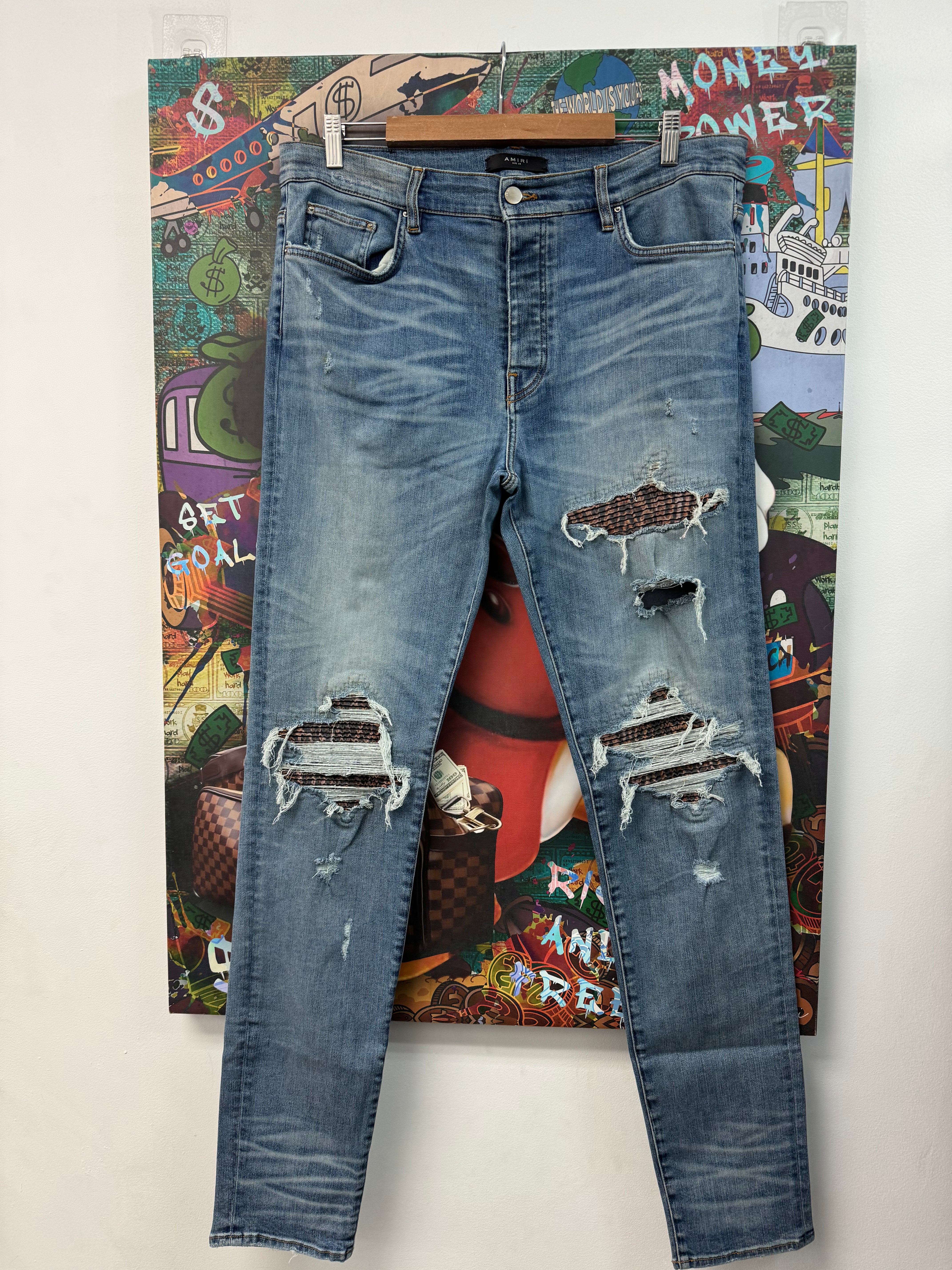 Amiri Light Wash Acid Patch MX1 Jeans