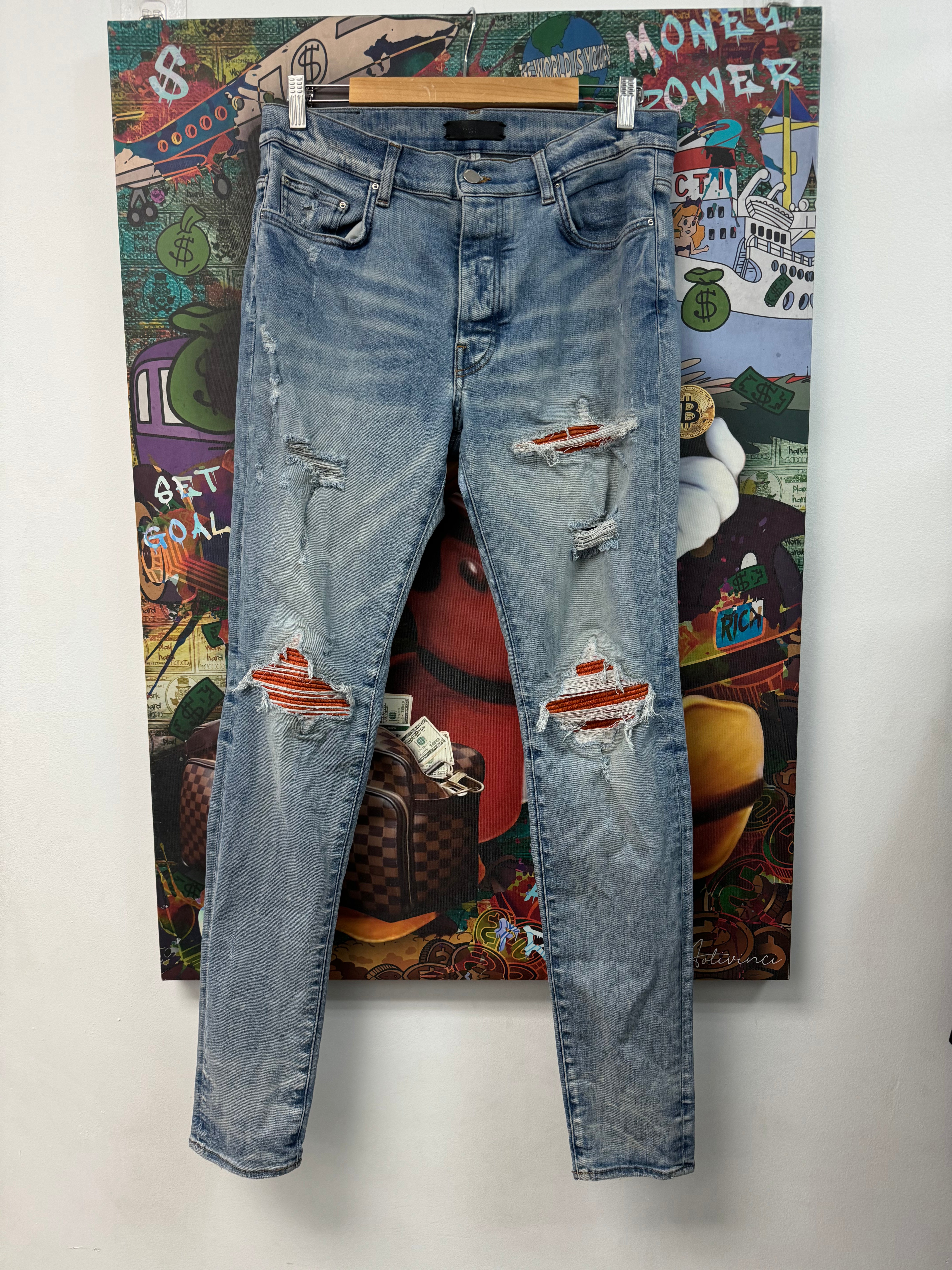 Amiri Light Wash Orange Crackle Patch MX1 Jeans