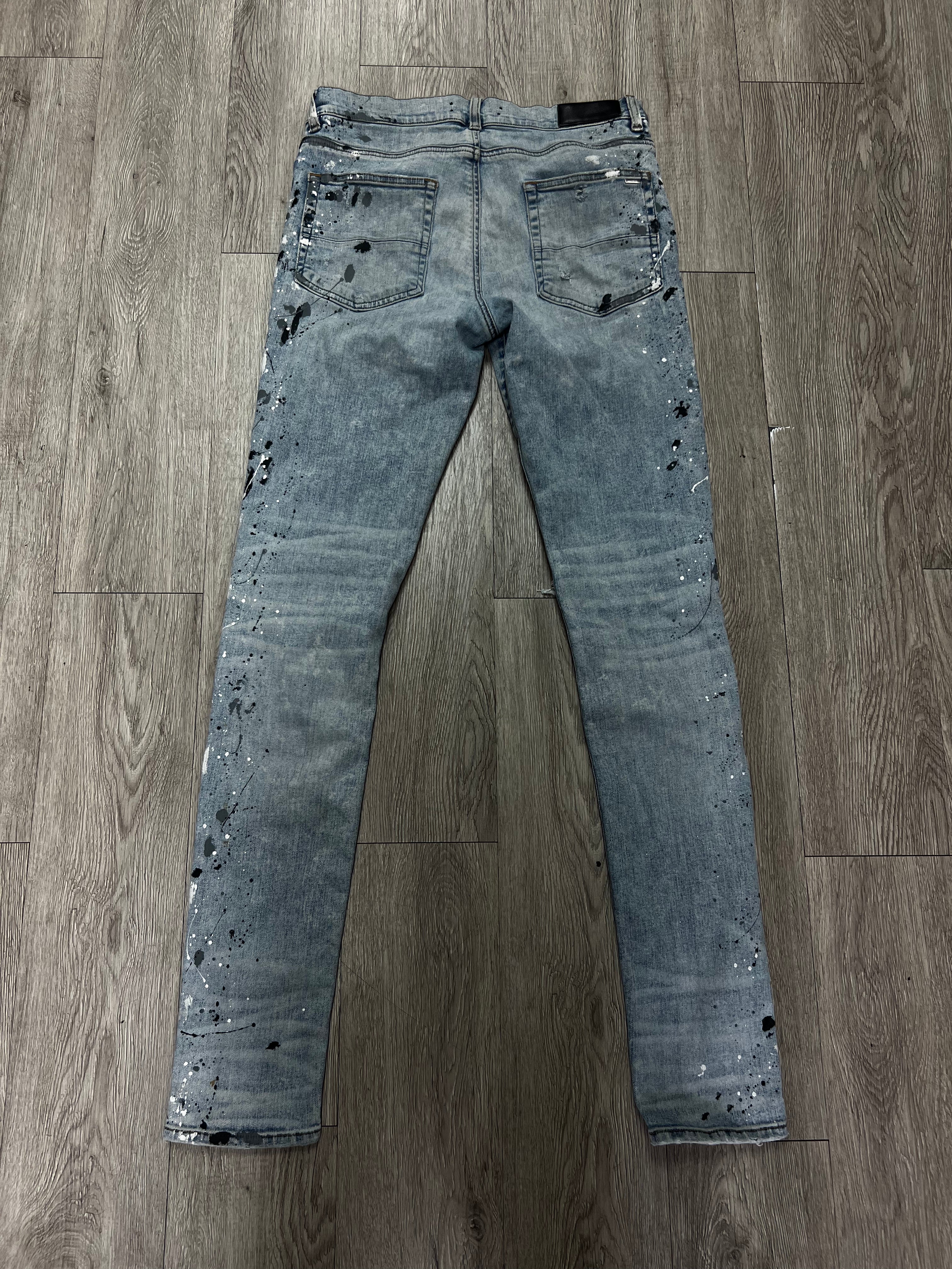 Amiri MX1 Light Wash Denim Splatter Patch Jeans
