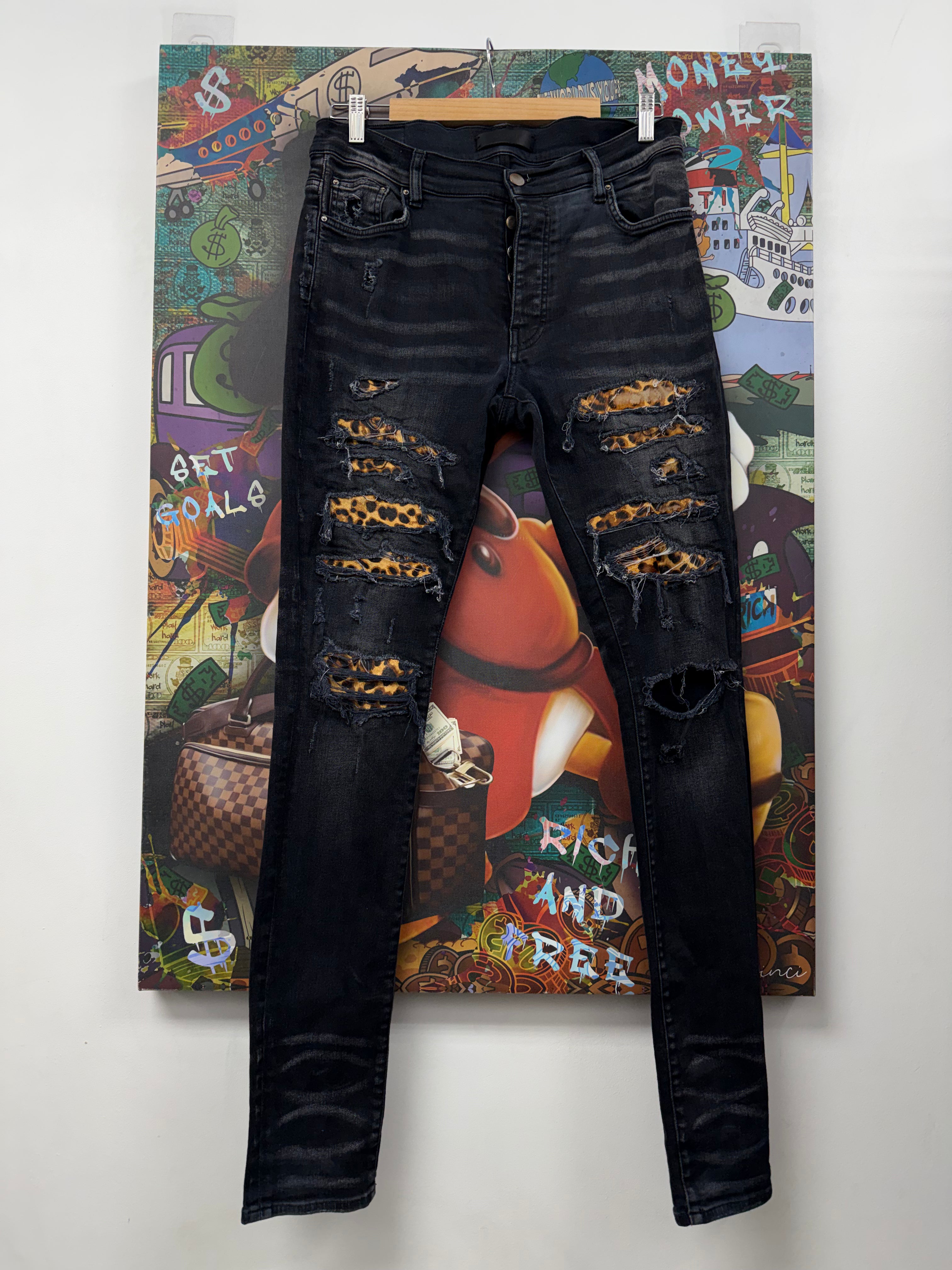 Amiri MX1 Black Thrasher Cheetah Jeans