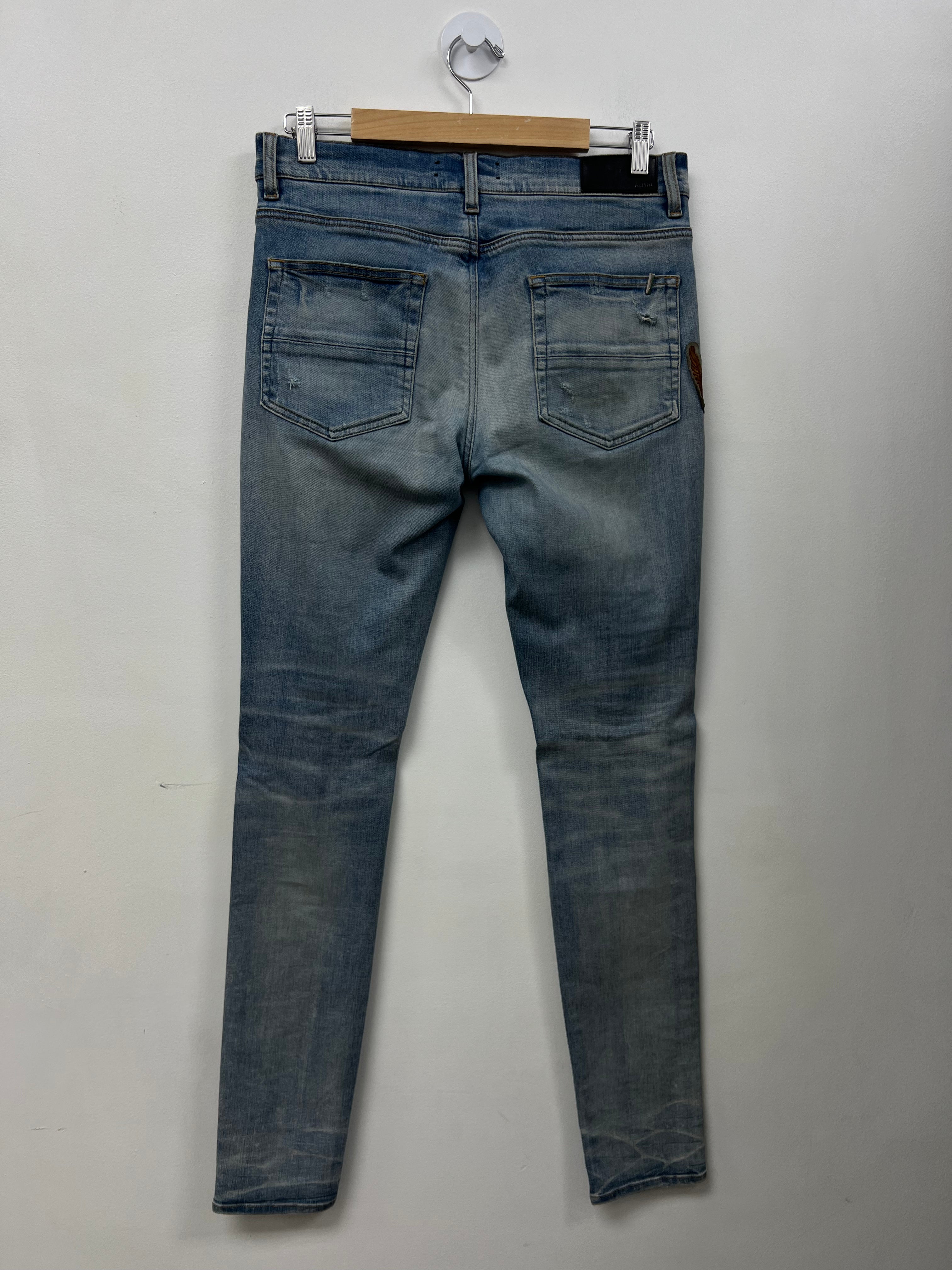 Amiri Light Wash Eagle Biker Patchwork Jeans