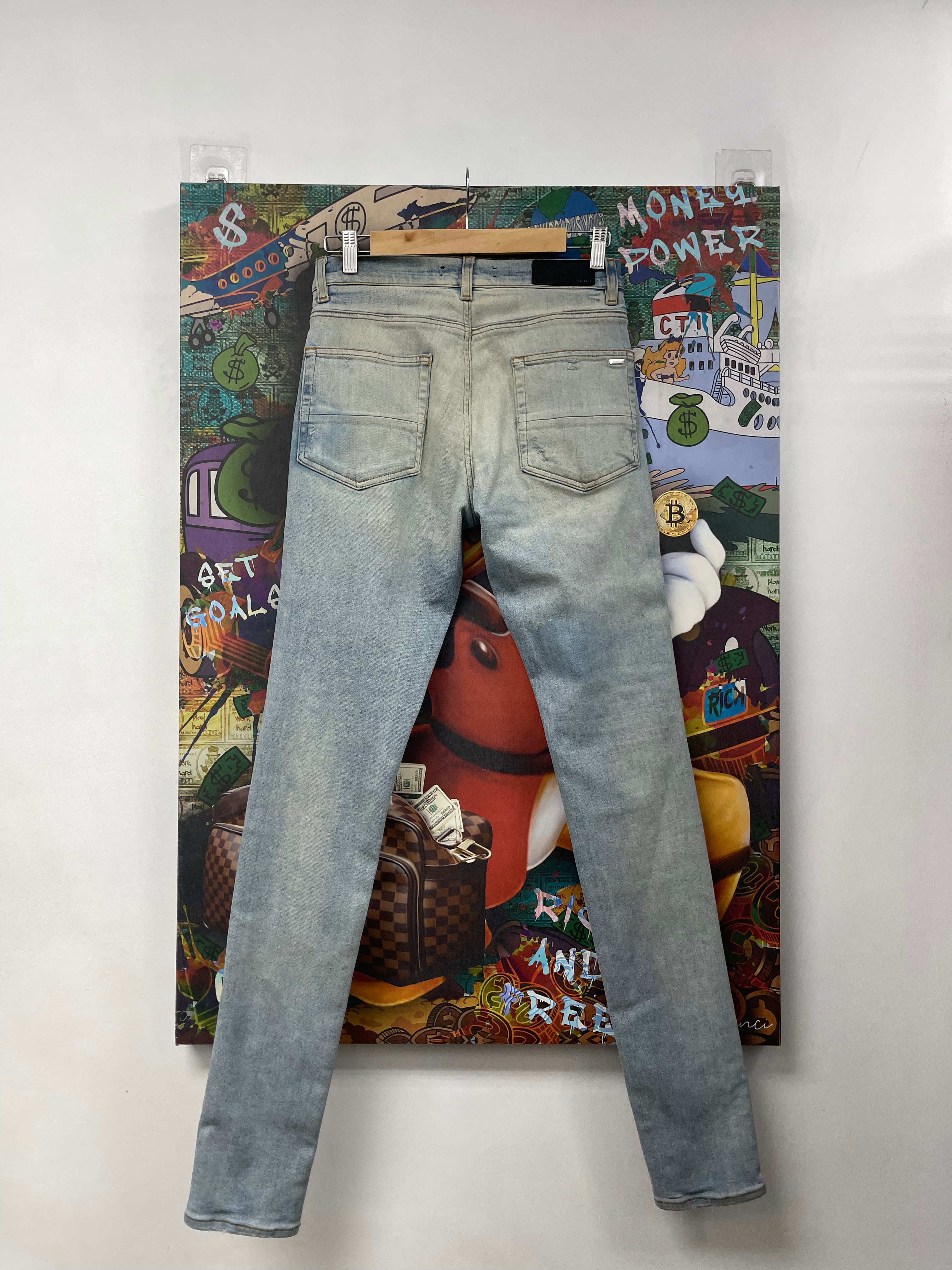 Amiri MX1 Light Wash Black Suede Patch Jeans