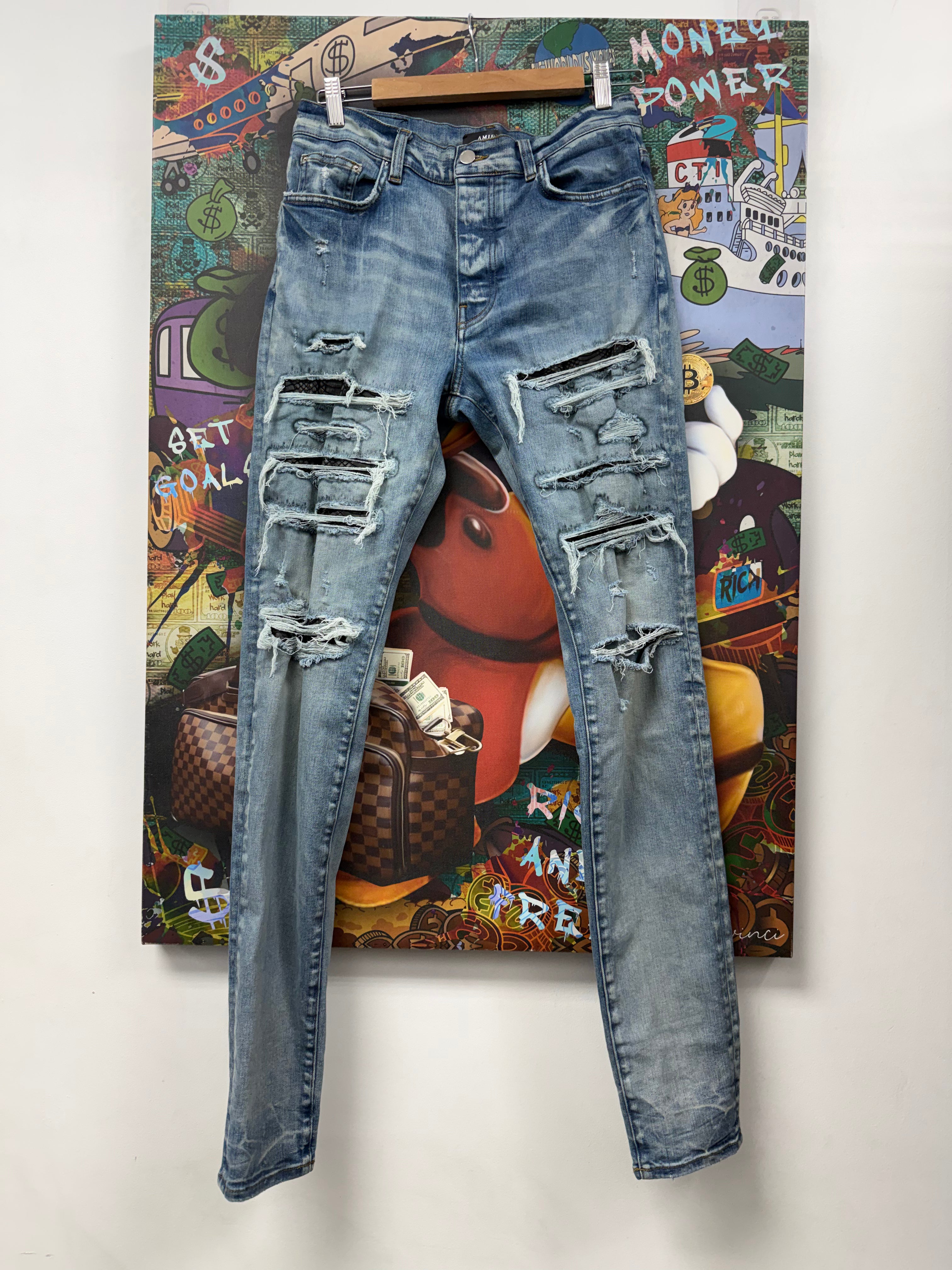 Amiri Light Wash Black Snakeskin Thrasher Jeans