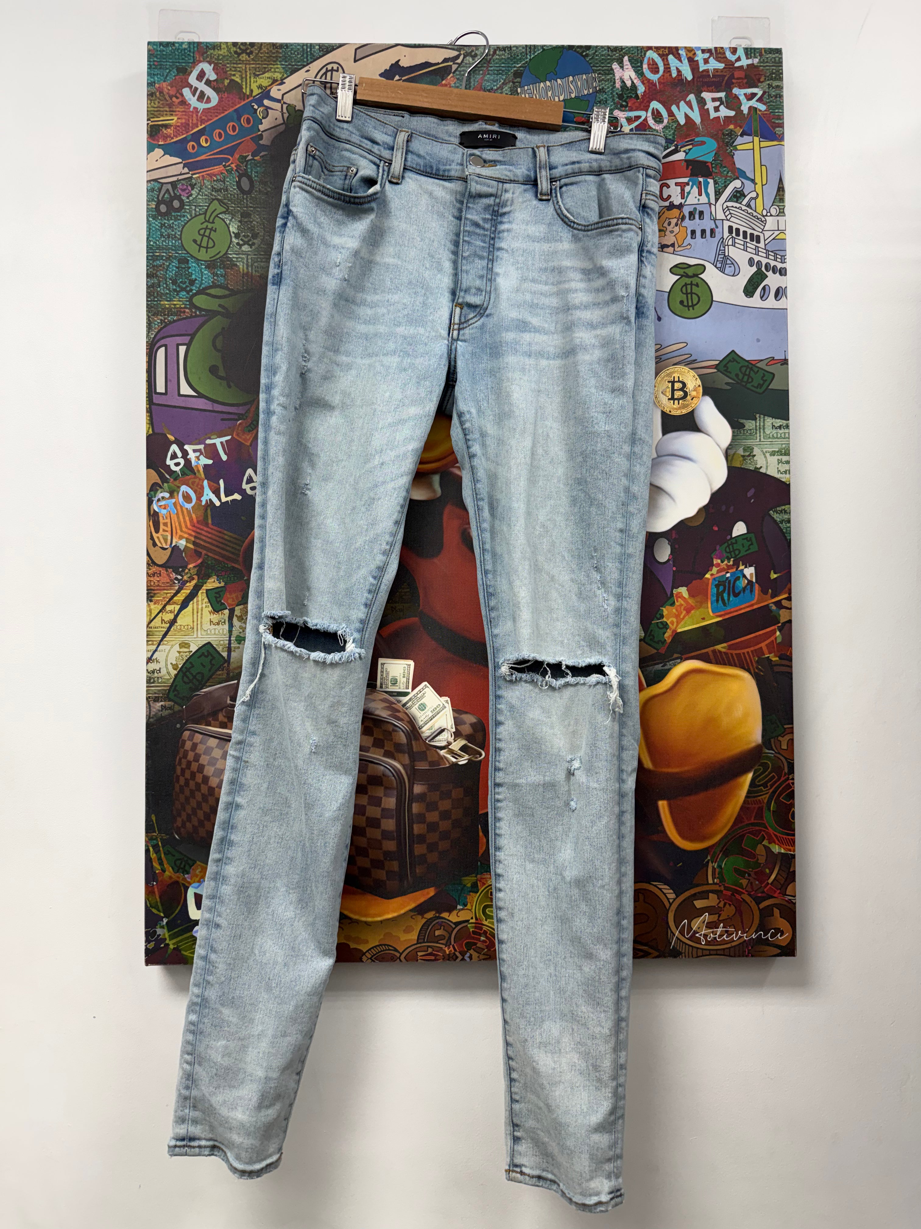 Amiri Light Wash Knee Ripped Thrasher Jeans