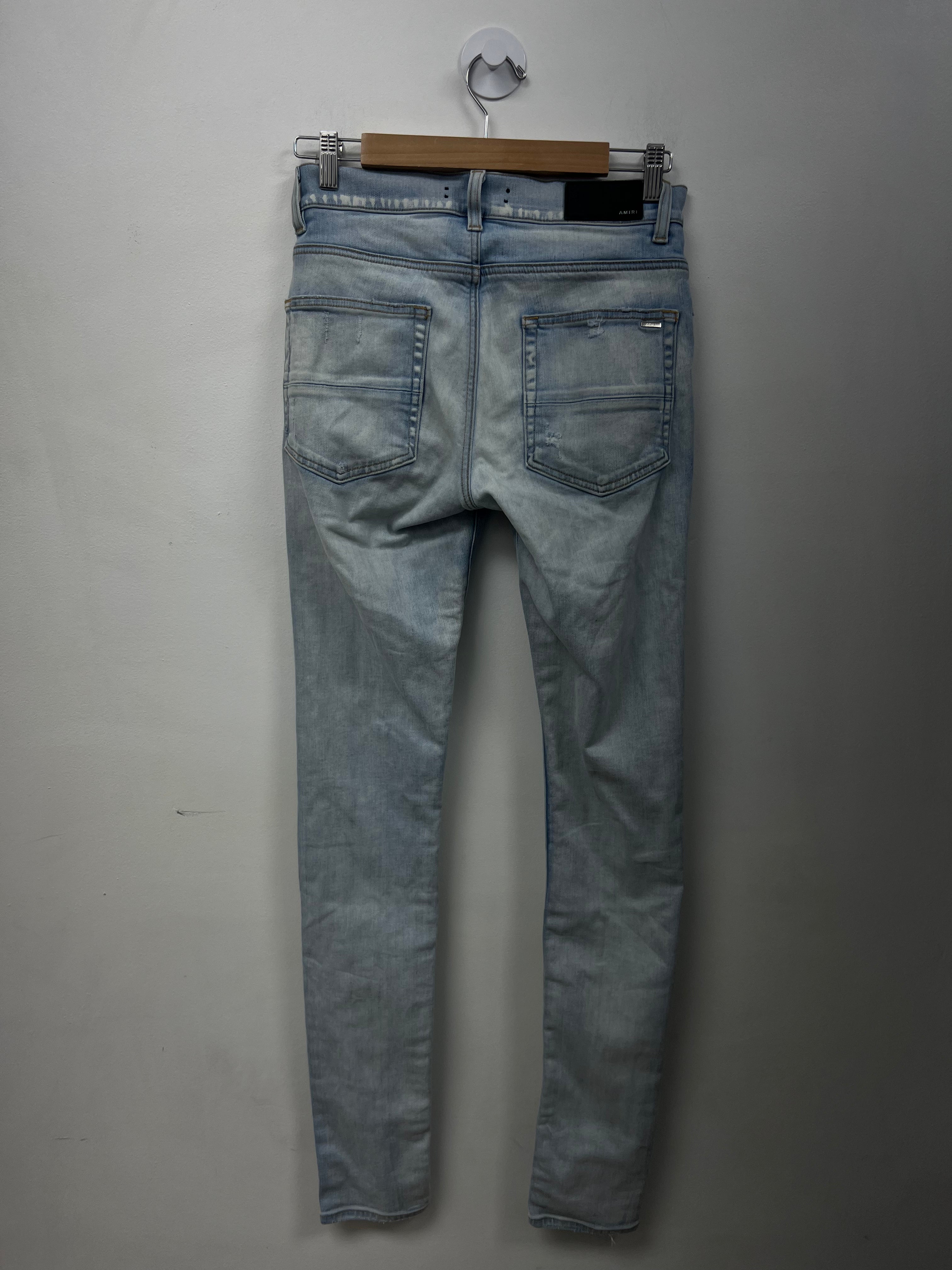 Amiri MX1 Light Wash Camo Patch Jeans