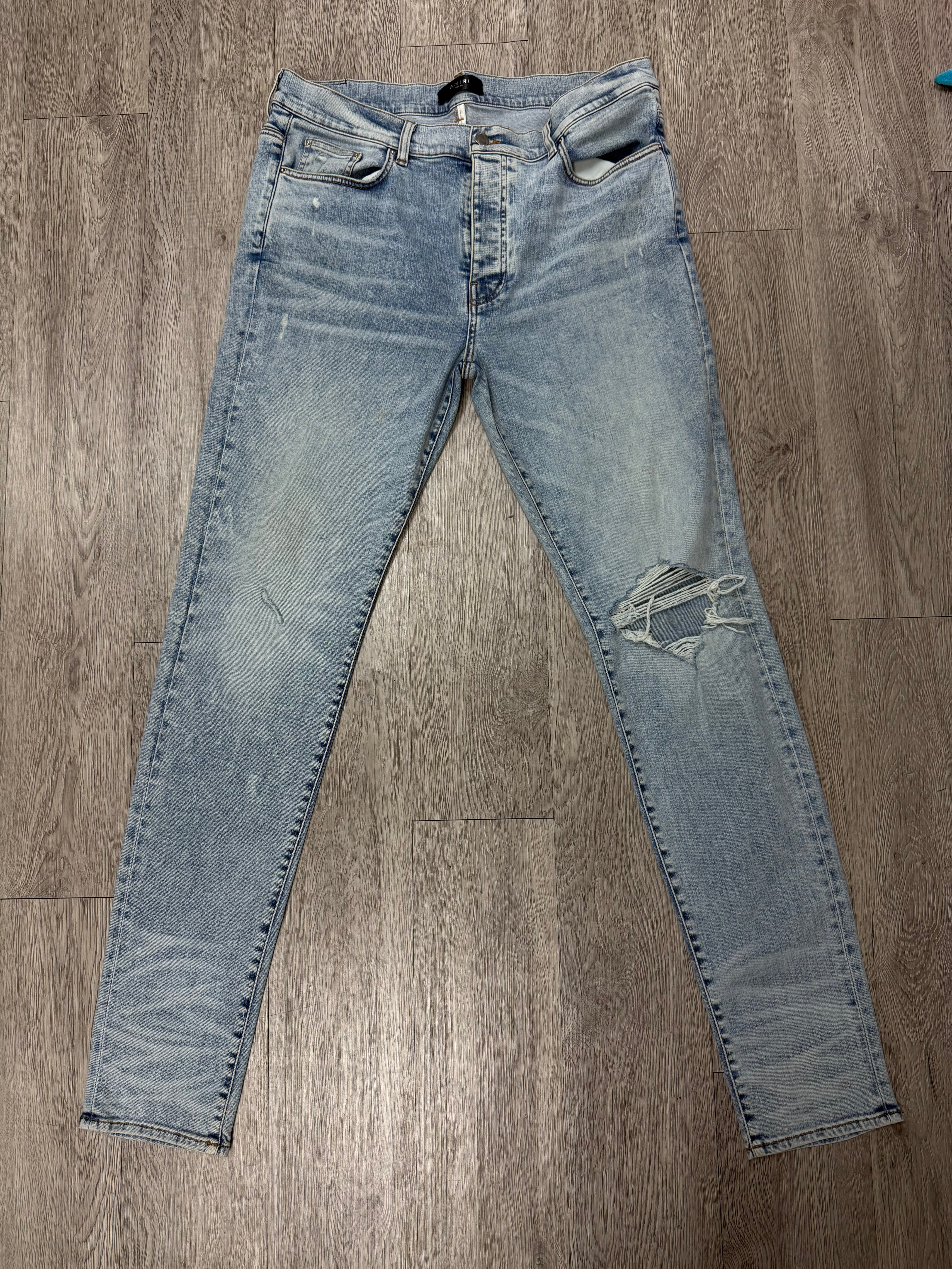 Amiri Light Wash Stone Wash Ripped Jeans