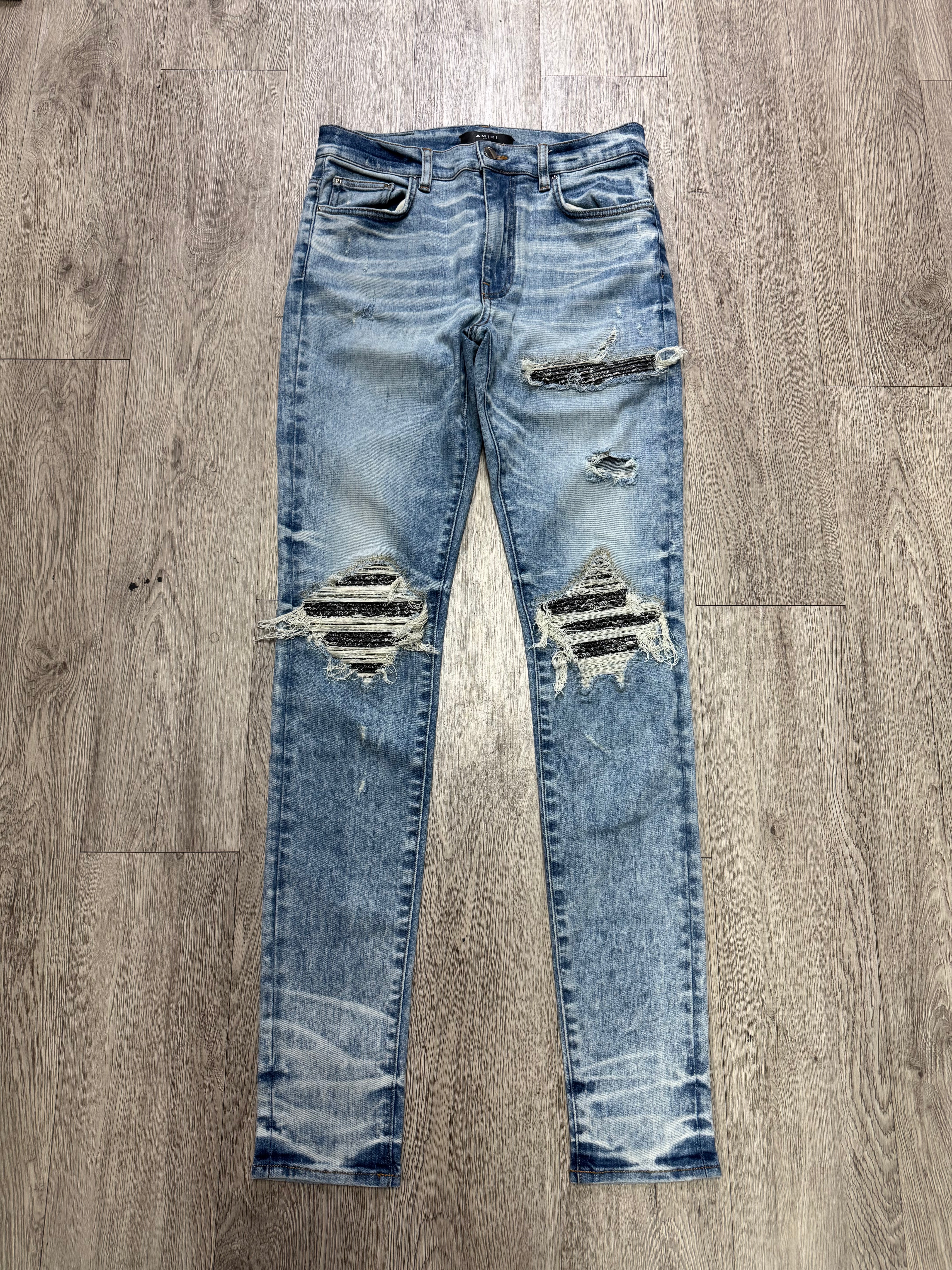 Amiri MX1 Light Wash Black Paisley Patch Jeans