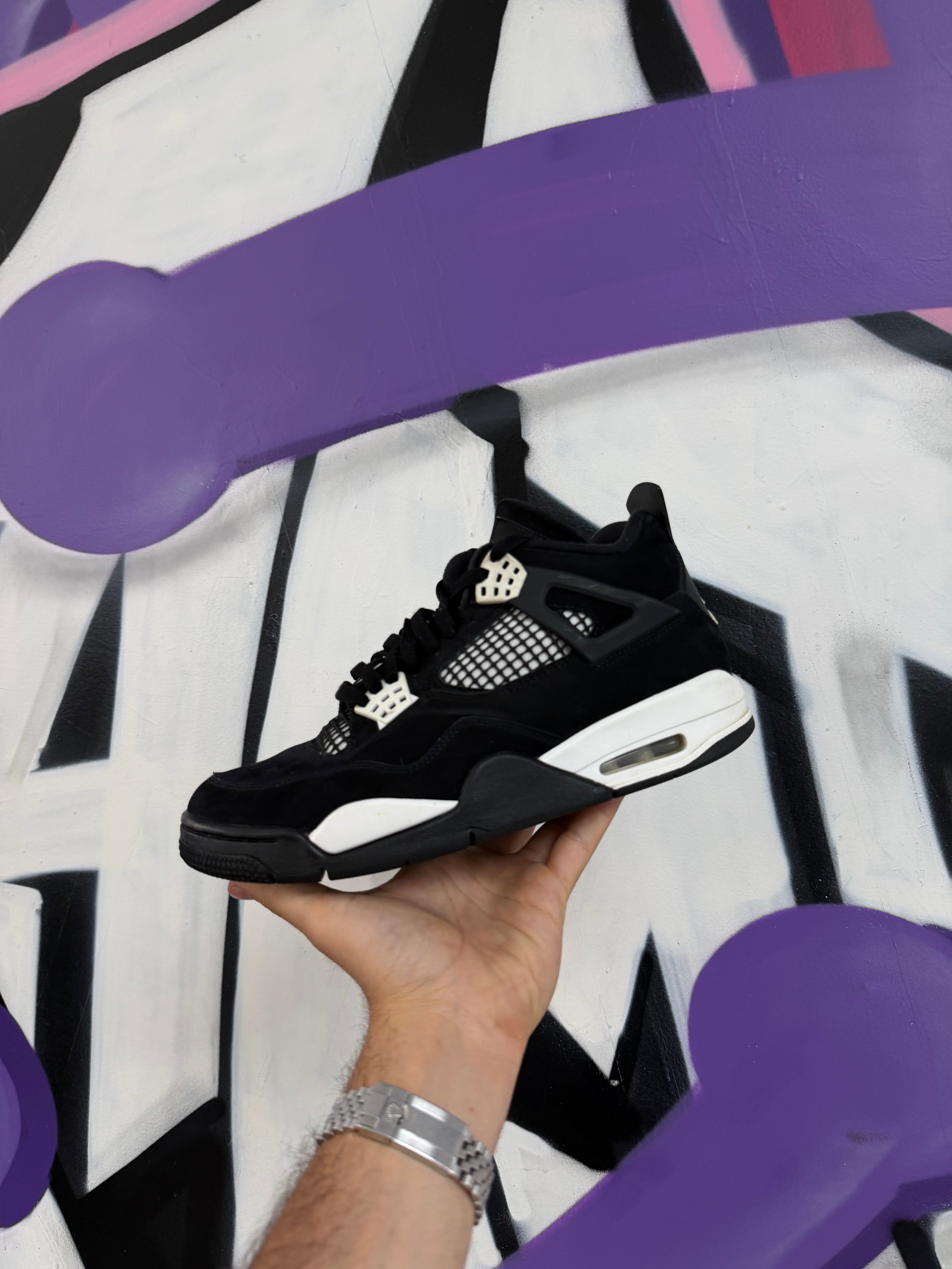 Jordan 4 Thunder Black & White Sneakers