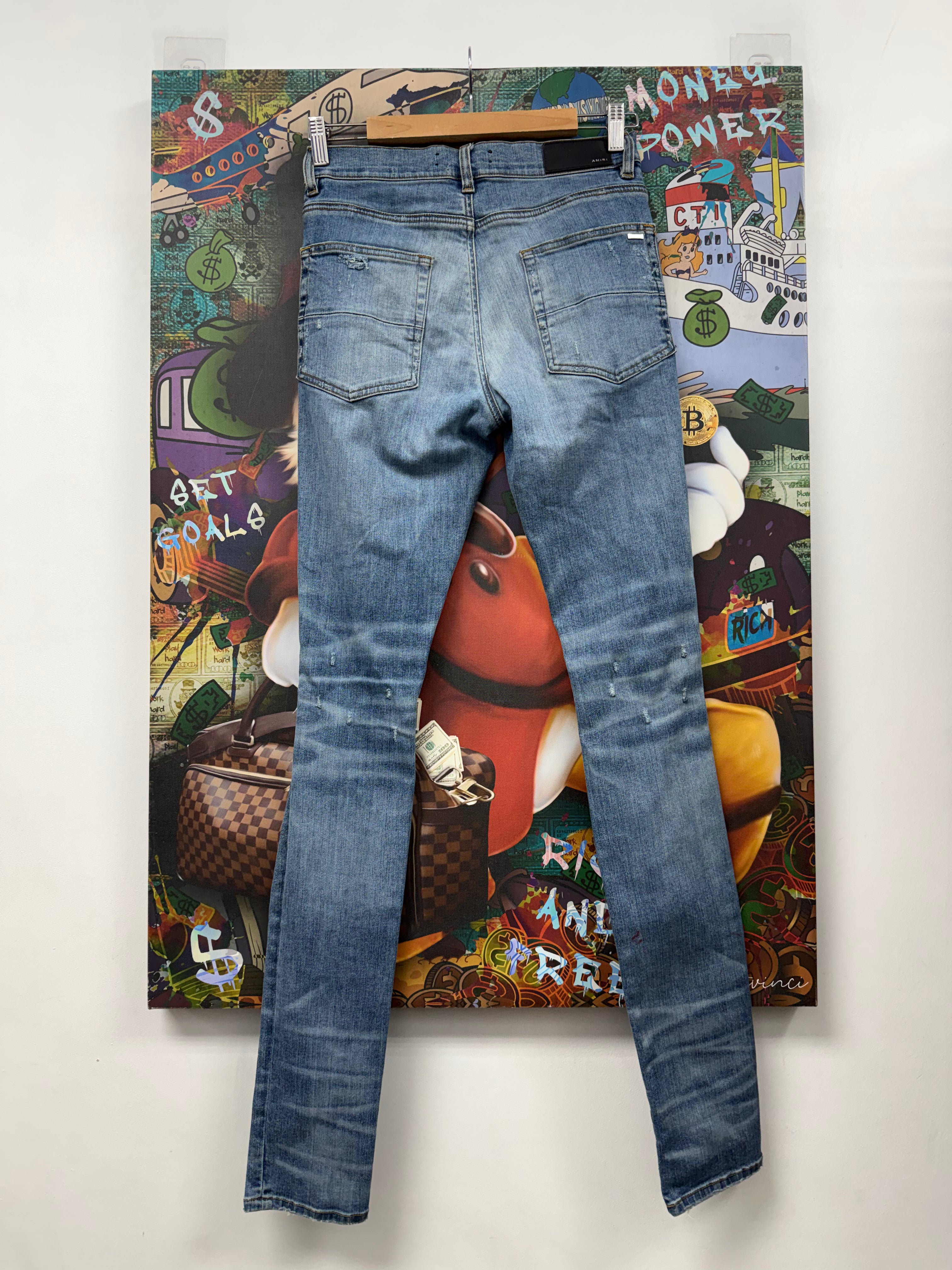 Amiri Light Wash Floral Thrasher Patch Jeans
