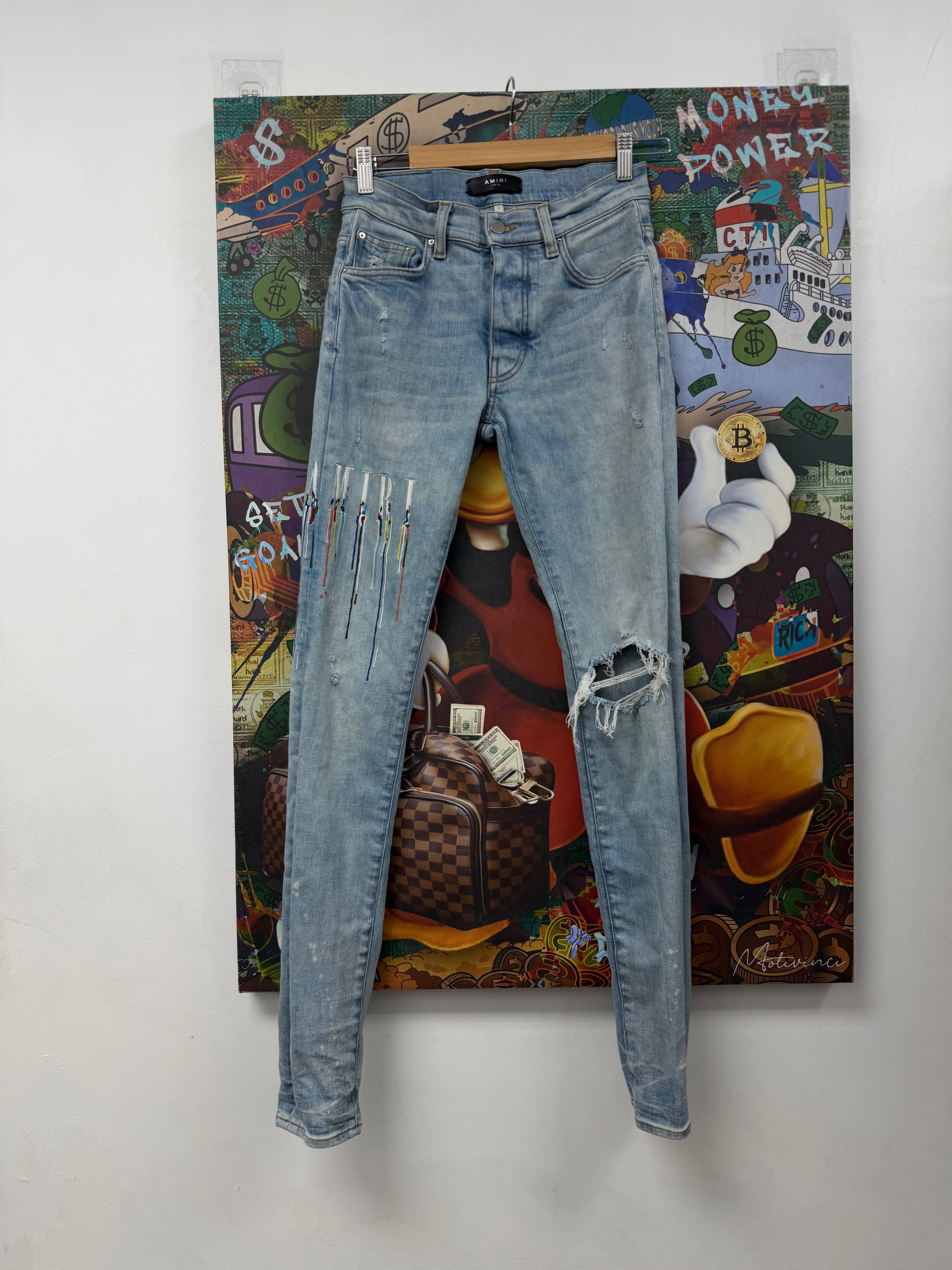 Amiri Light Wash Paint Drip Jeans