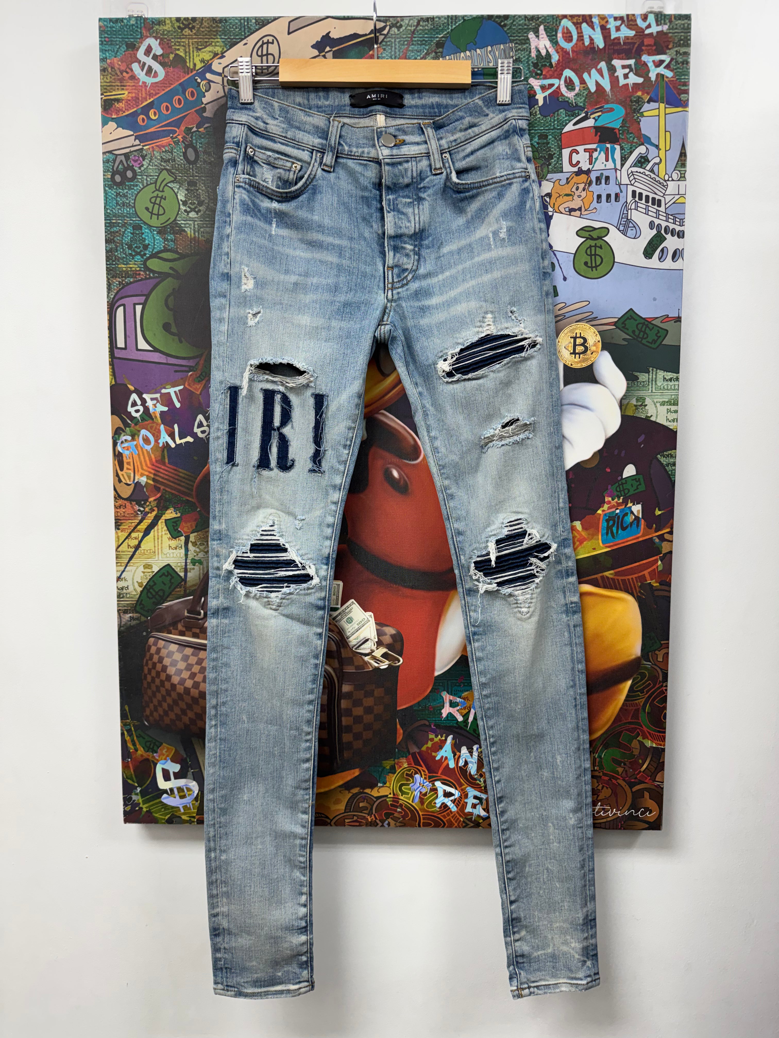 Amiri MX1 Light Wash Denim Applique Patch Jeans