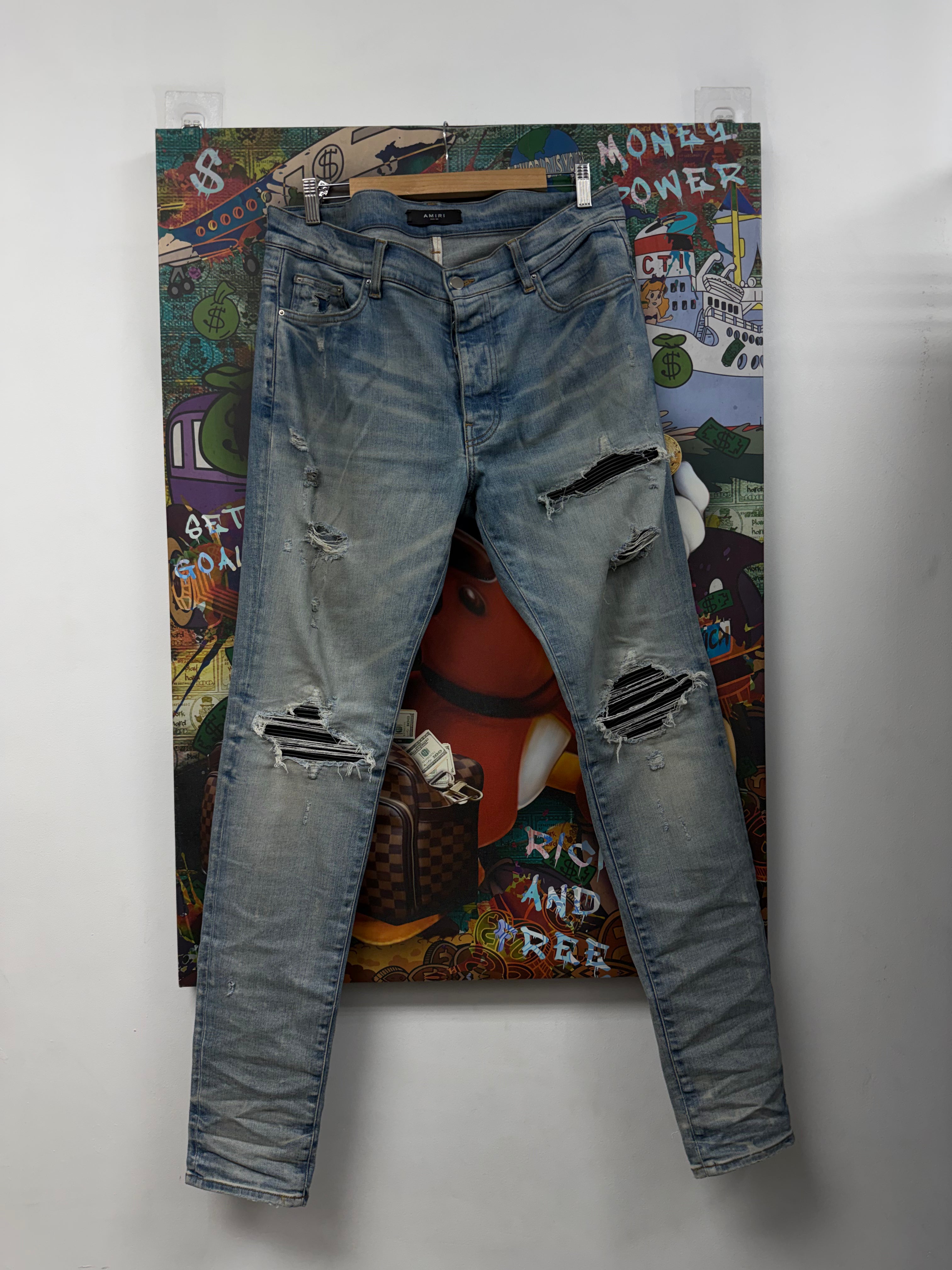 Amiri MX1 Light Wash Black Patch Jeans